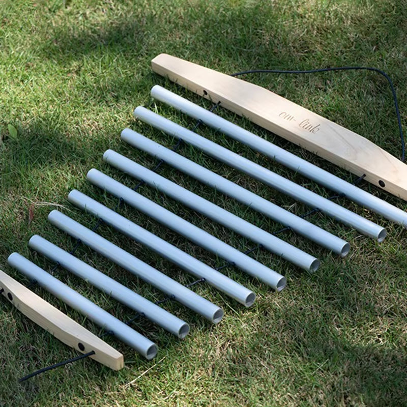 PVC pipe xylophone mounted on wooden supports in a 9 Notes Swinging Wind Chime for Healing