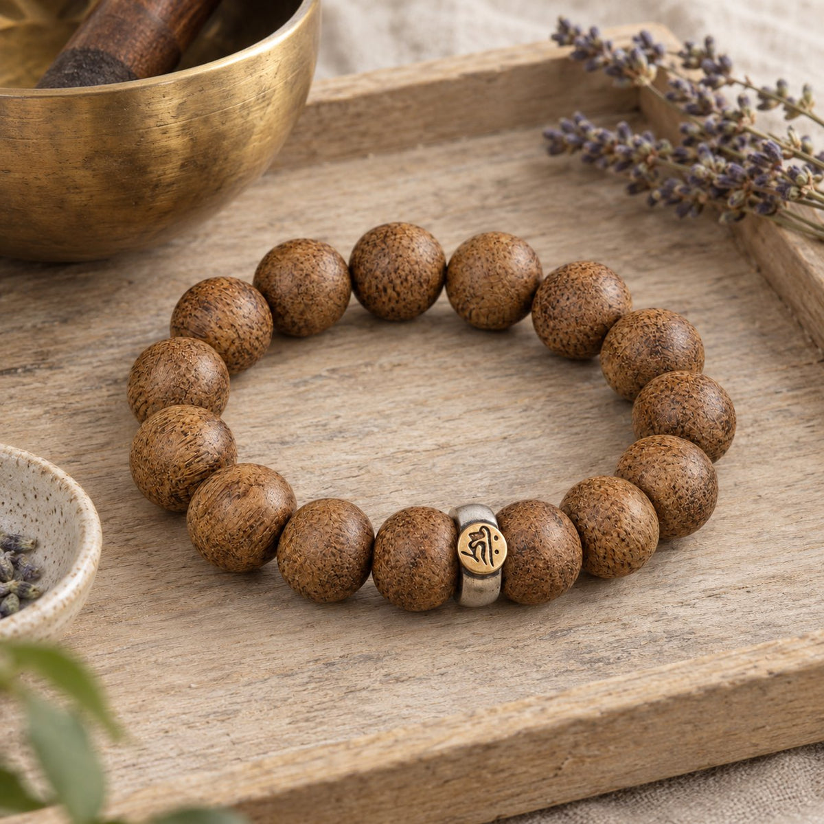Natural Agarwood Chinese Zodiac Peace Bracelet 12mm Beads, styled with a singing bowl and lavender