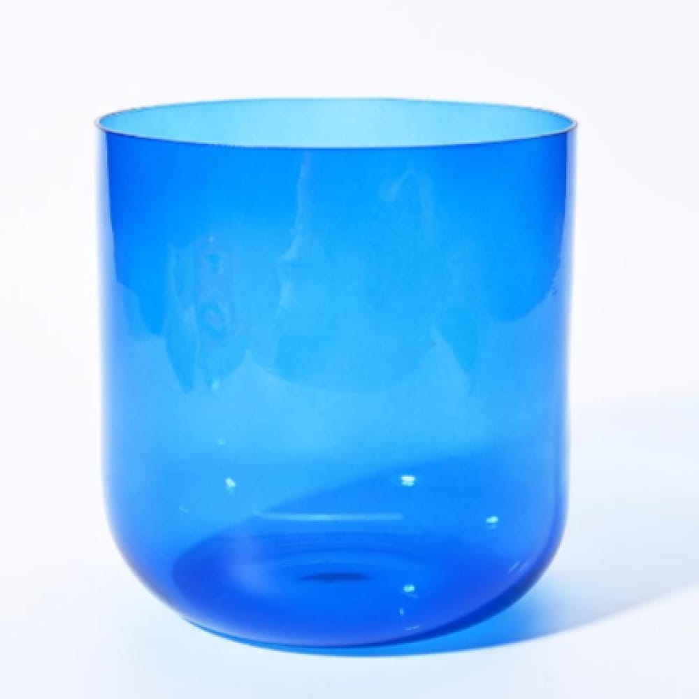 Bright blue translucent cylindrical glass vessel of Alchemy Clear Indigo bowl