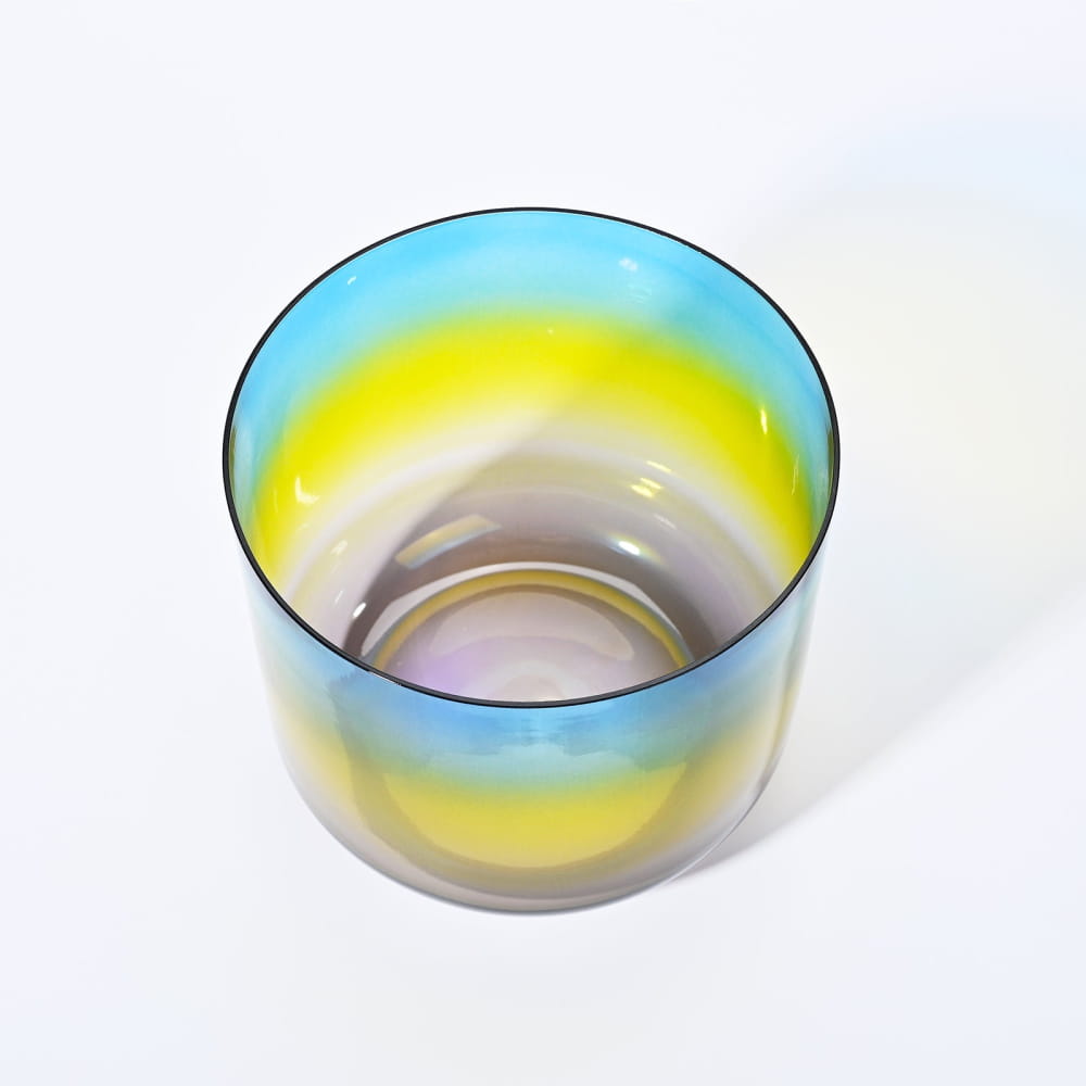 Iridescent glass bowl with blue and yellow bands from Alchemy Clear Rainbow A Note