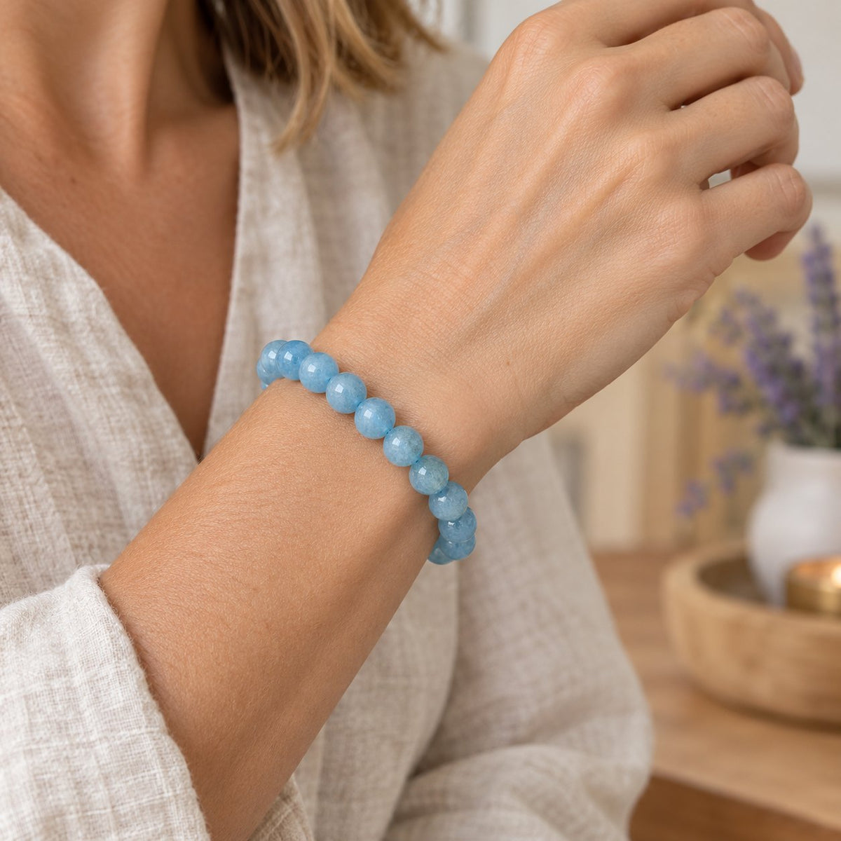 8mm Aquamarine Healing Beads Peace Bracelet, worn on the wrist by a woman