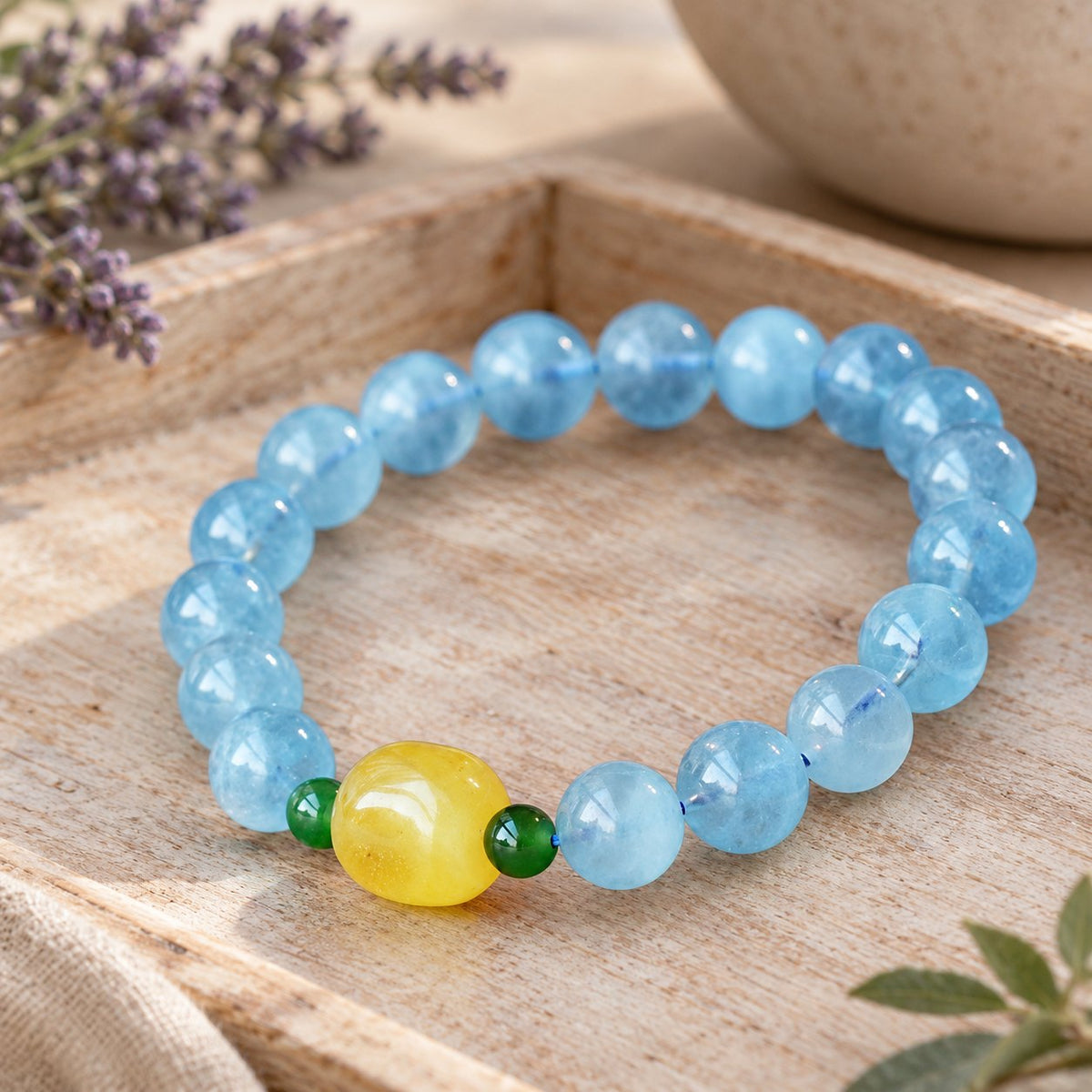 Natural Aquamarine Amber Serenity Healing Bracelet 8mm, front view in a wooden bowl