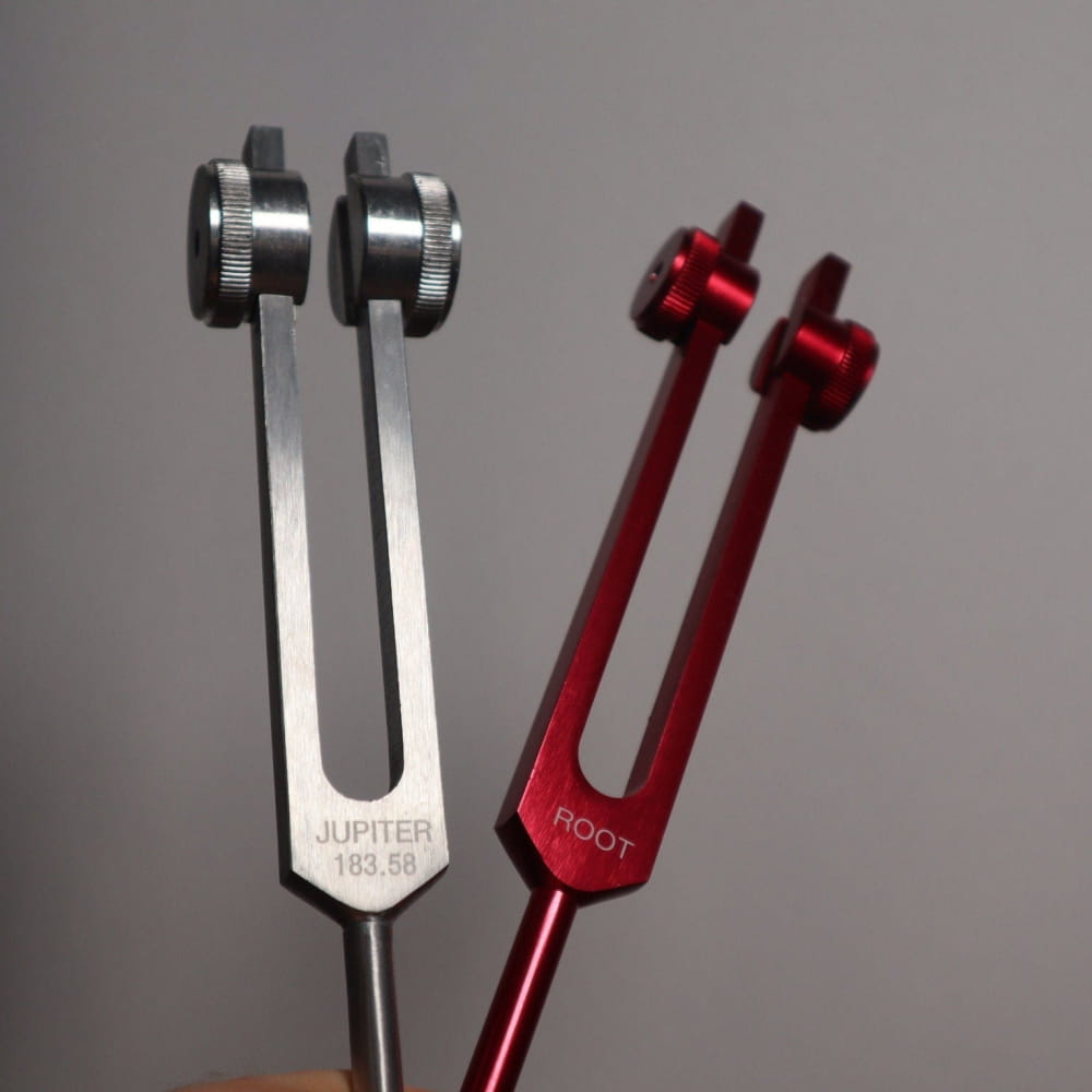 Astrology and Chakra Tuning Fork Set featuring silver and red metallic tuning forks