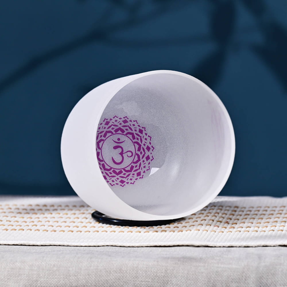 White ceramic bowl featuring a purple Om symbol for healing and meditation