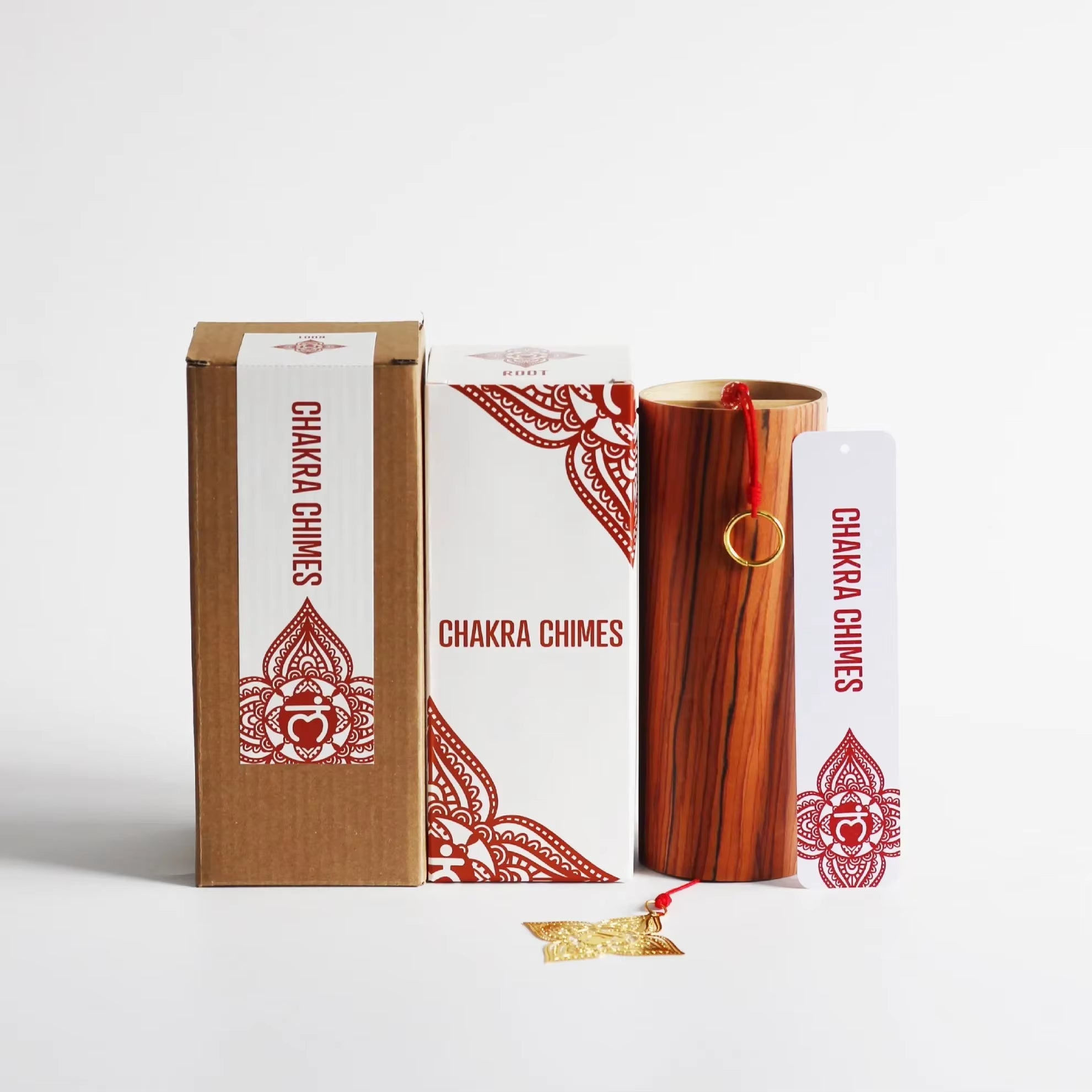 Wooden chime and packaging boxes with red Chakra designs for Bamboo Koshi Wind Chimes