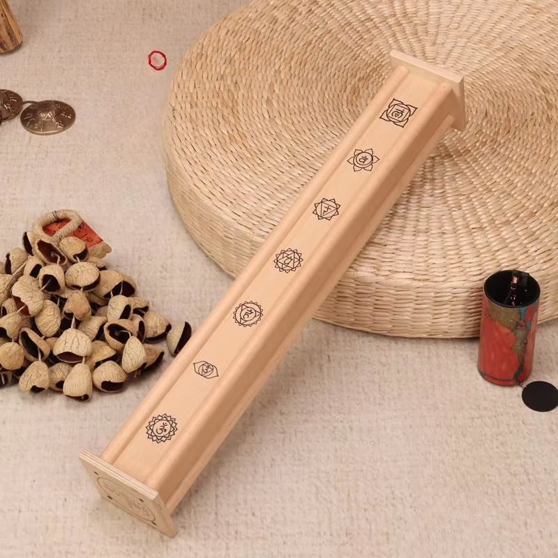 Wooden incense holder featuring chakra symbols, part of Birch Wood Rain Stick for meditation