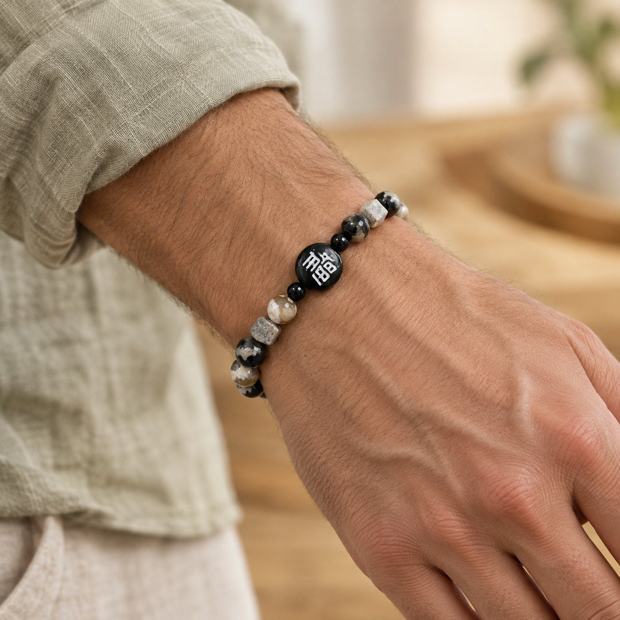 8mm Black Onyx Agate Bracelet with Fu Fortune Symbol, worn on the wrist by a man