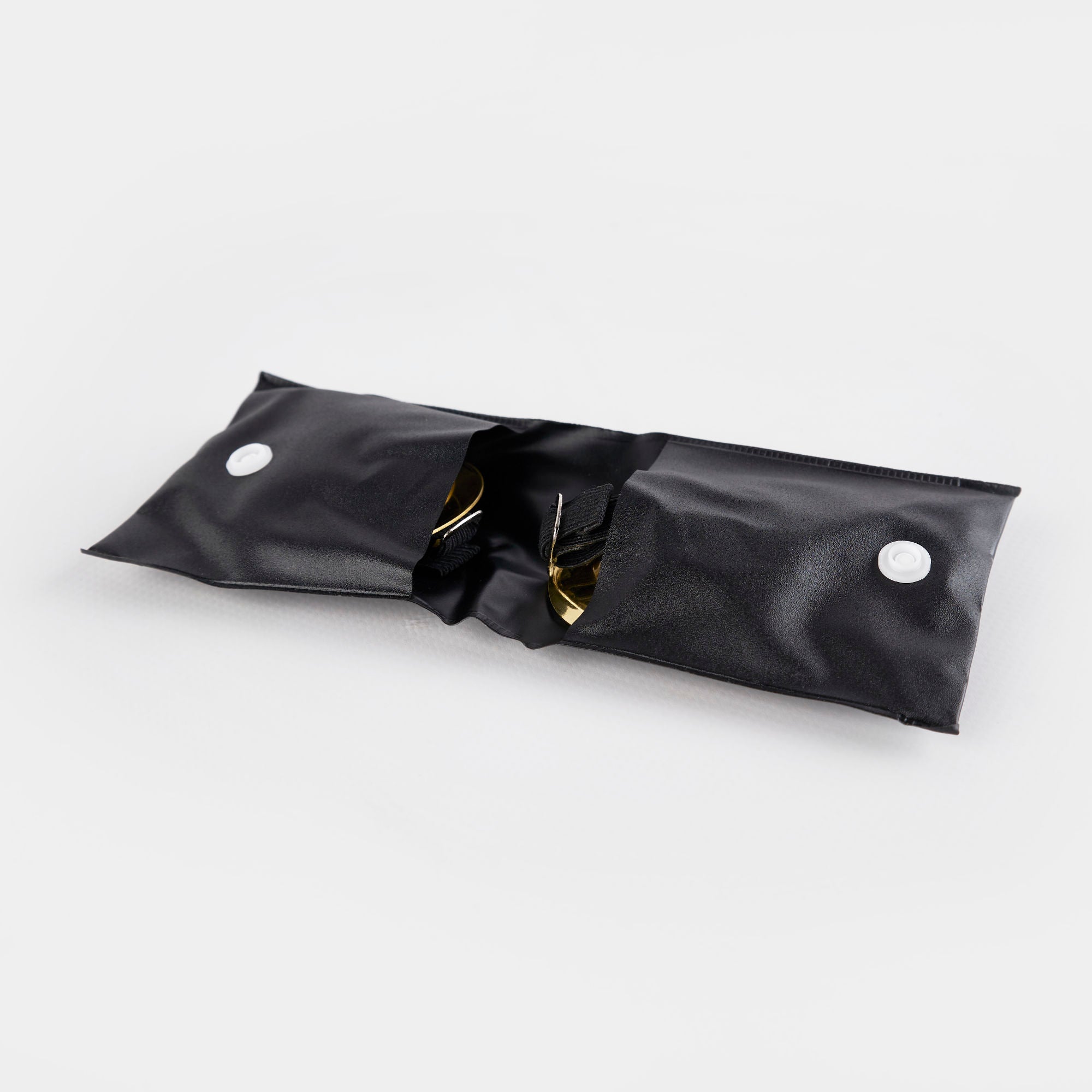 Black plastic bag with two circular holes for Buddha Hand Finger Cymbals