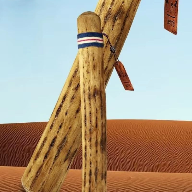 Wooden baseball bat with red, white, and blue striped band near handle for Cactus Rainstick