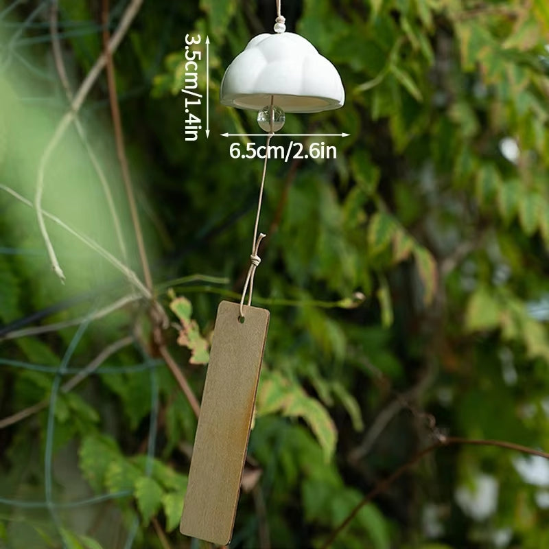 White ceramic dome-shaped wind chime with a rectangular pendant for home decor