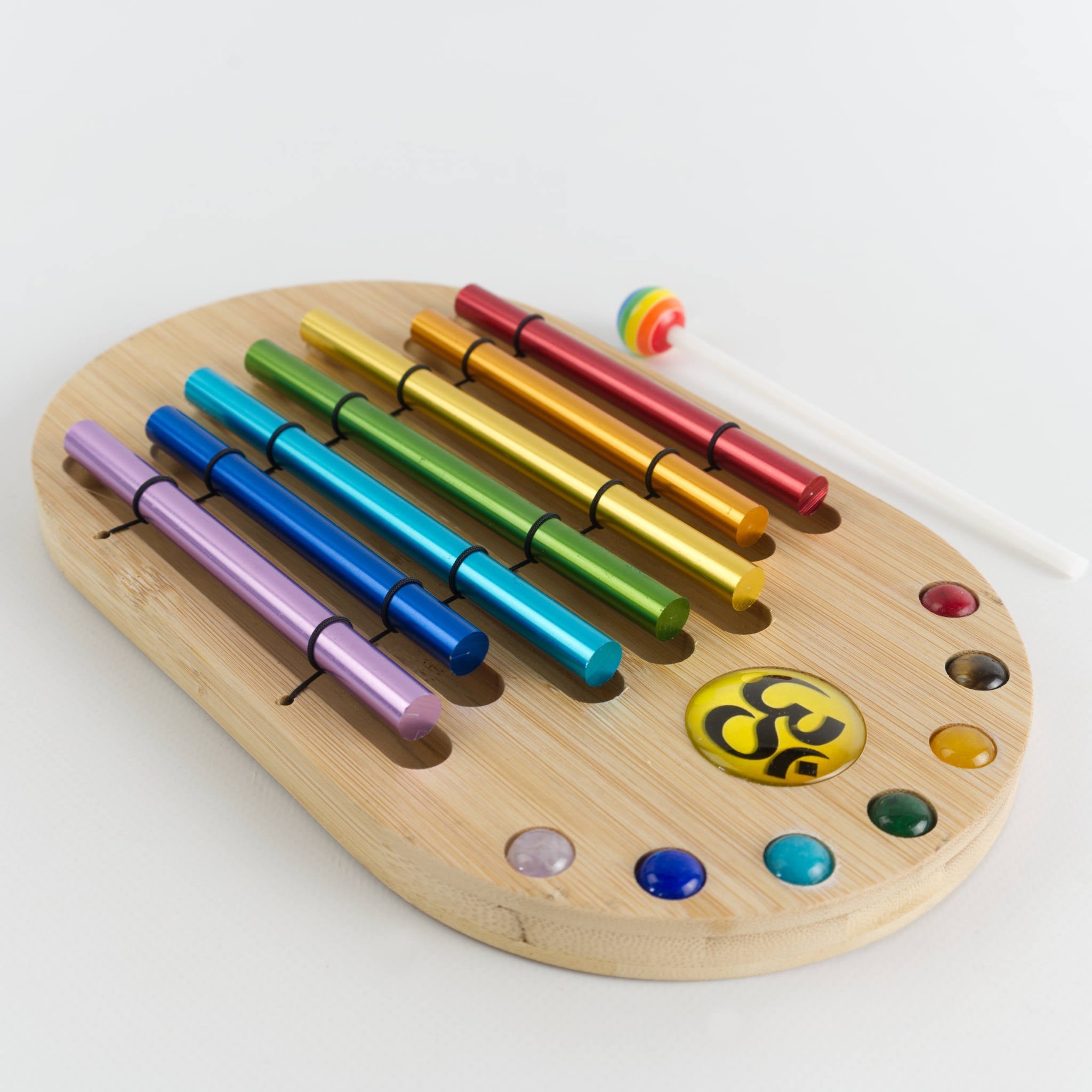 Wooden palette with colorful metallic tubes and paint wells for Chakra Energy Chimes Set