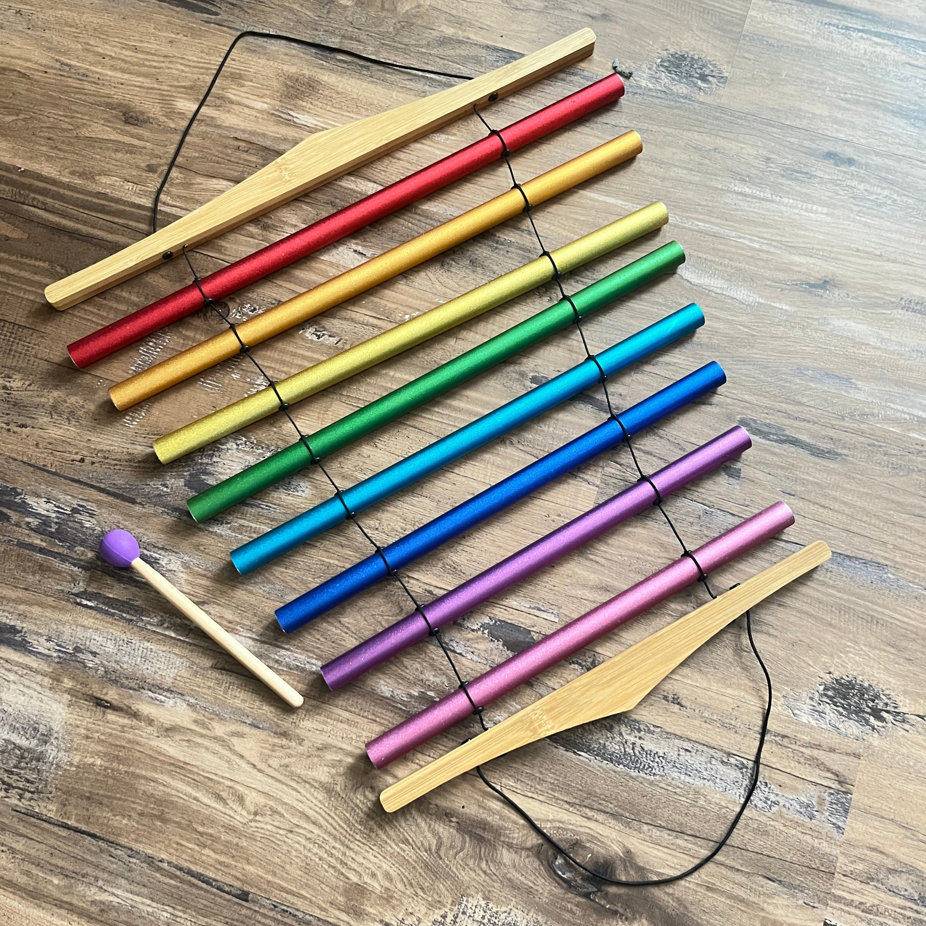 Colorful drumsticks in rainbow arrangement for Chakra Schumann Swinging Chimes 8-Note, flow chimes