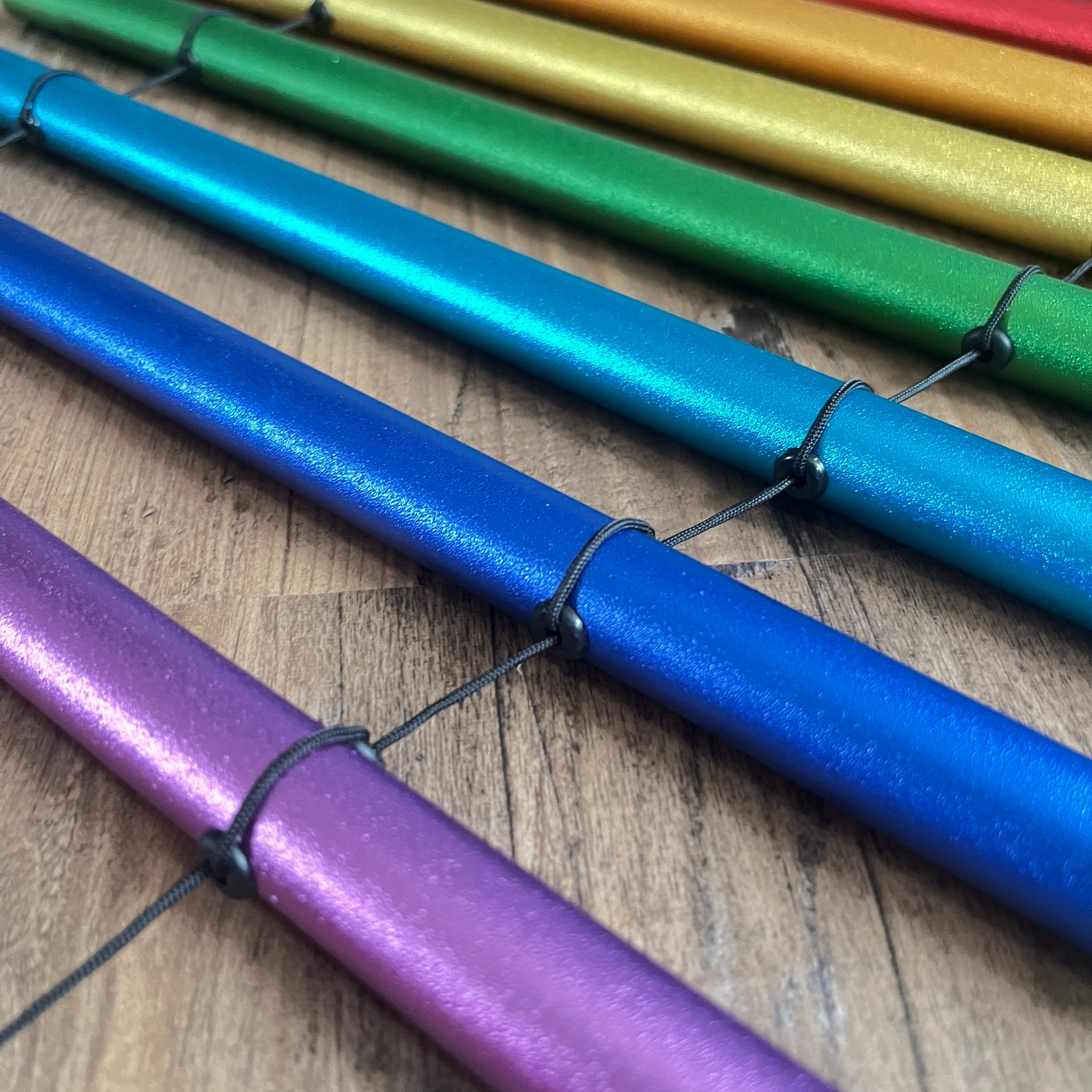 Metallic markers in rainbow hues for Chakra Schumann Swinging Chimes 8-Note