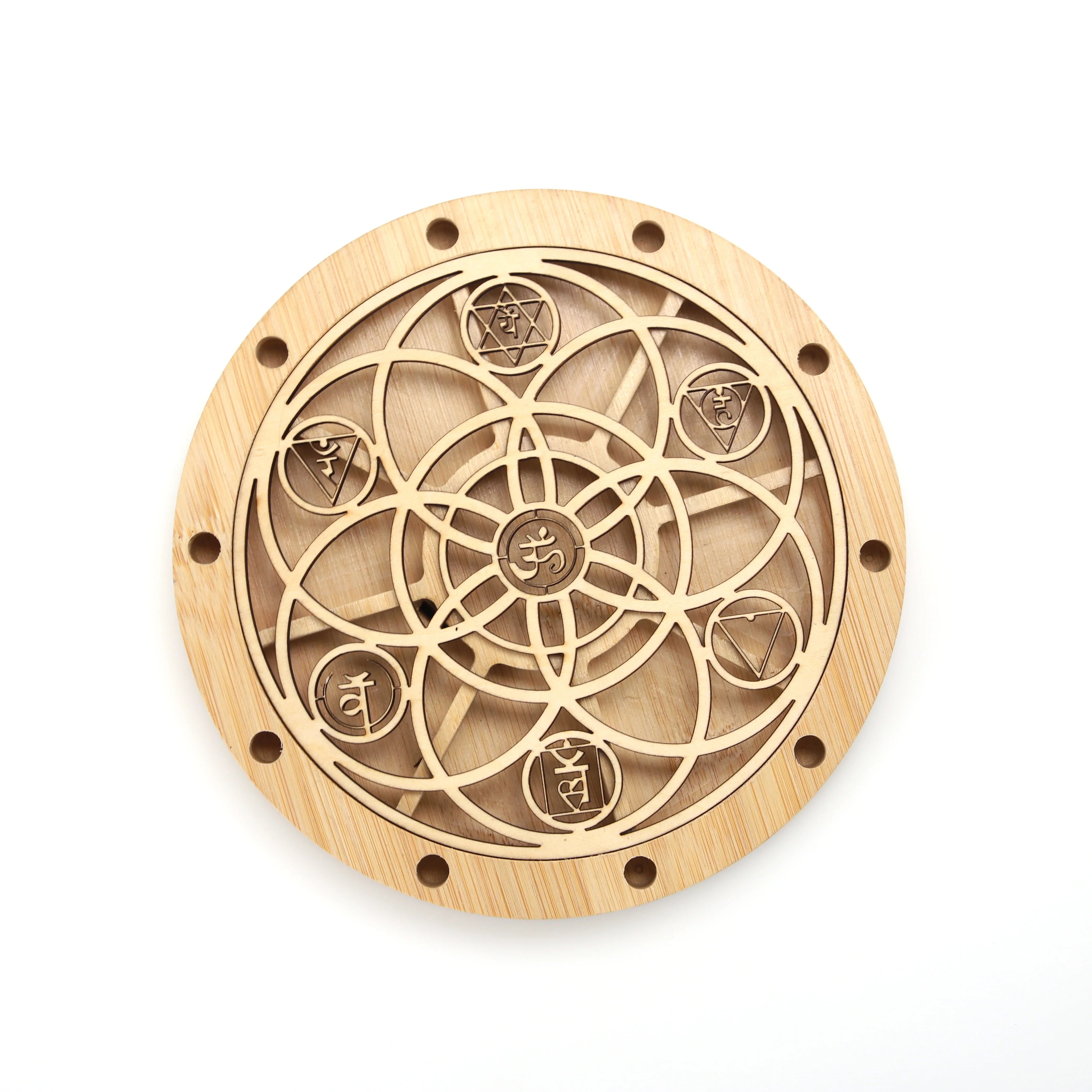 Circular wooden medallion with geometric pattern on Chakra Tuning Fork Holder Stand