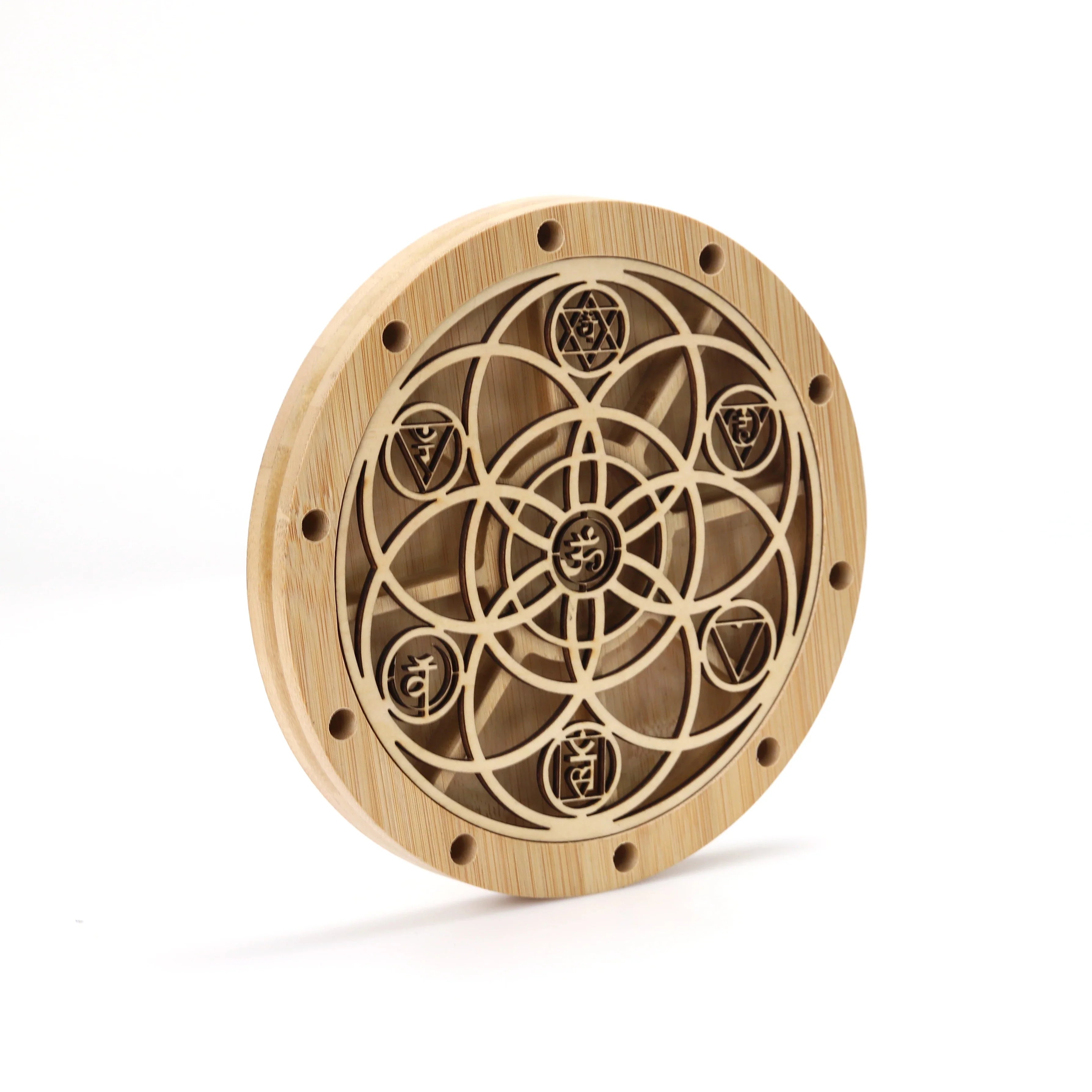 Wooden circular plaque with sacred geometry, Om symbol, and chakra designs for stand