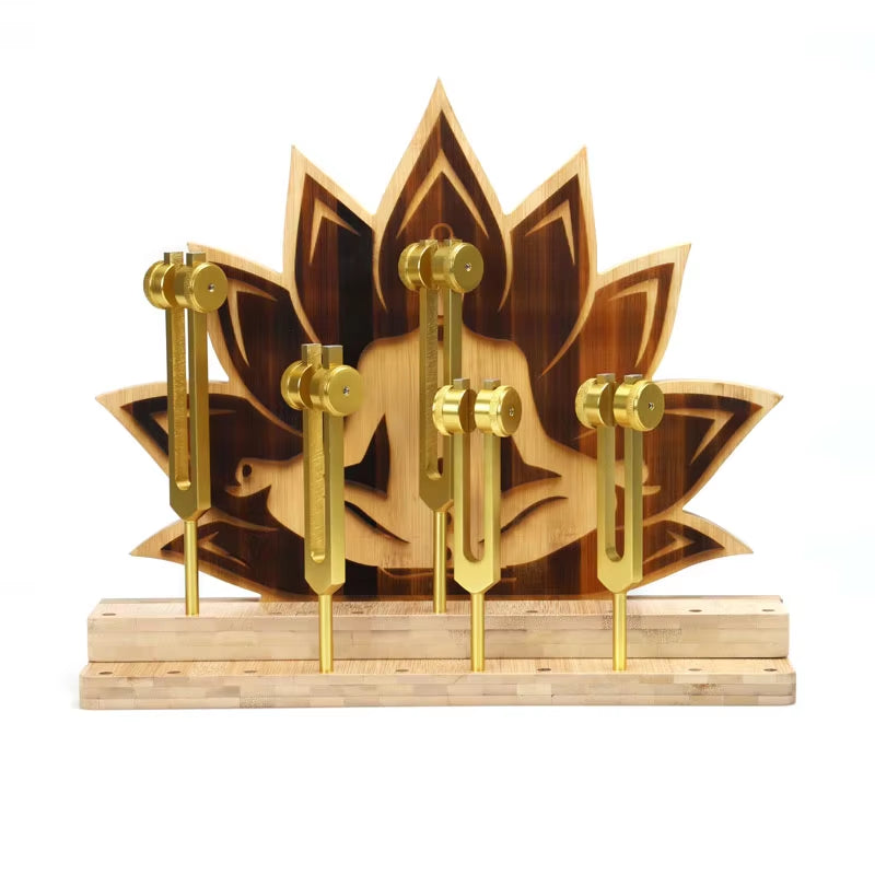 Decorative wooden lotus flower with gold-colored keys on Chakra Tuning Fork Stand