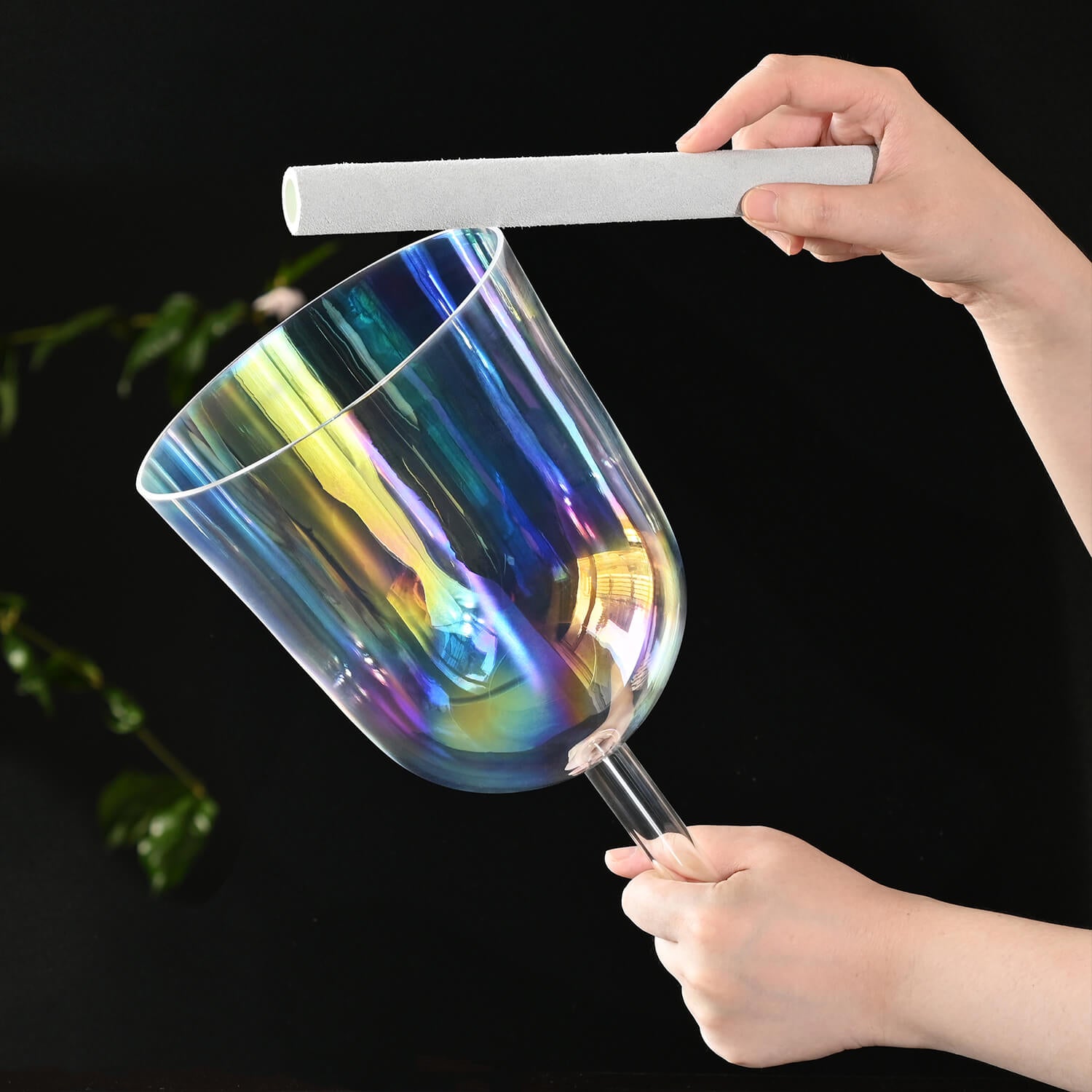 Iridescent wine glass with rainbow holographic finish next to Clear Rainbow Quartz Crystal Singing Bowl