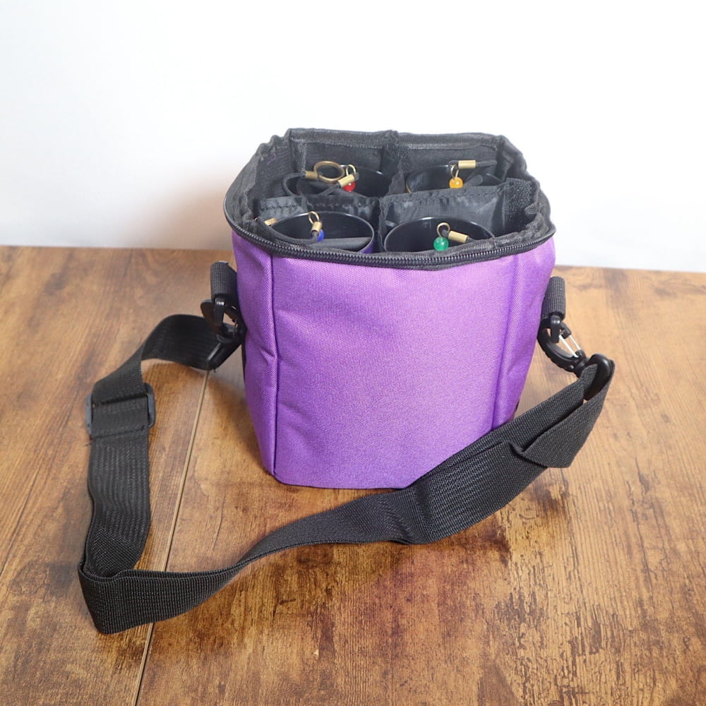 Purple cylindrical bag with black strap for storing Colored Koshi Chimes Set