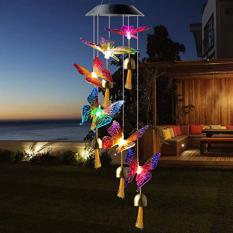 Solar-powered wind chime featuring colorful light-up butterflies and decorative tassels