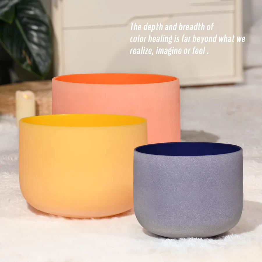 Three colored Quartz Crystal Singing Bowls in Peach, Yellow, and Navy Blue