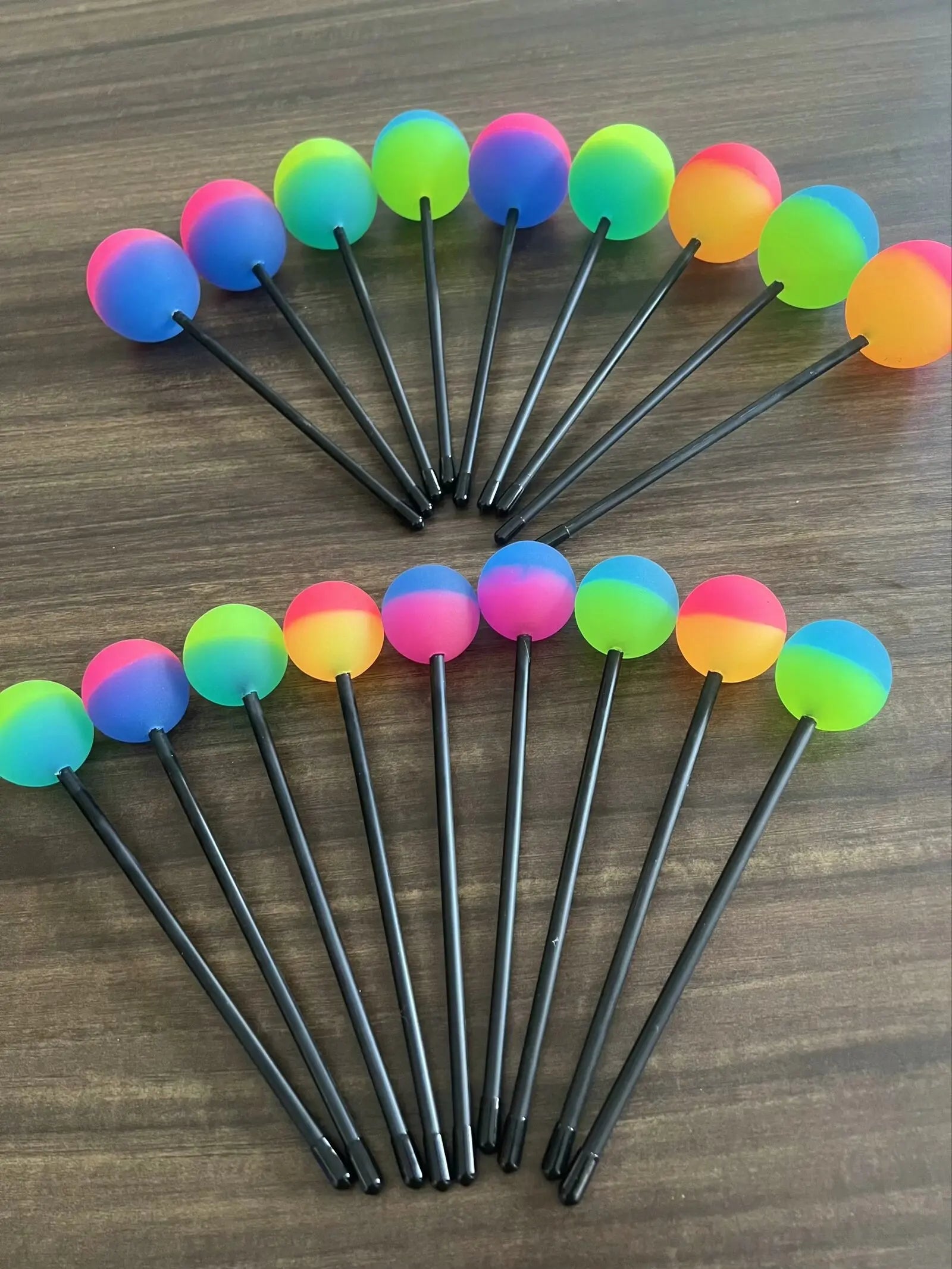 Rainbow-colored glowing balls on rods in a fan for Colorful Silicone Whale Sound Gong Mallet Stick