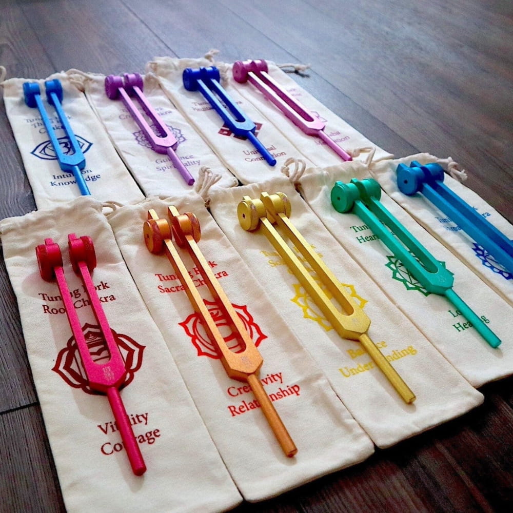 Colorful tuning forks on fabric pouches in Complete 9pc Weighted Solfeggio Set