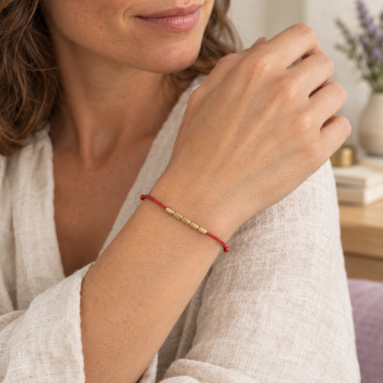 Handcrafted Copper Red String Protection Bracelet, worn on the wrist by a woman
