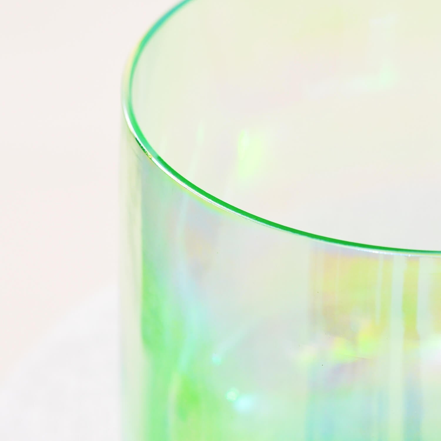 Curved rim of translucent green glass in Cosmic Light Clear Green Crystal Singing Bowl Set