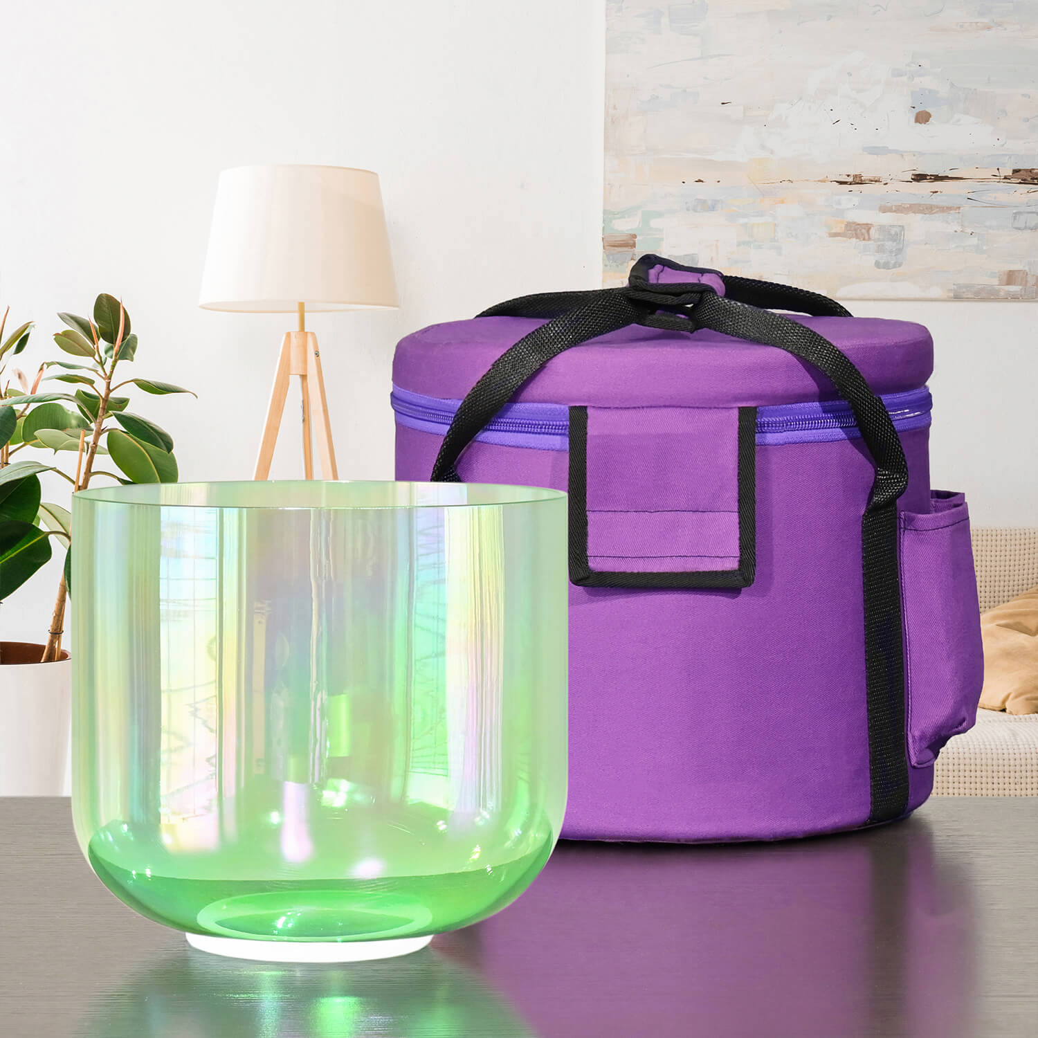 Iridescent green crystal singing bowl with purple carrying case for meditation