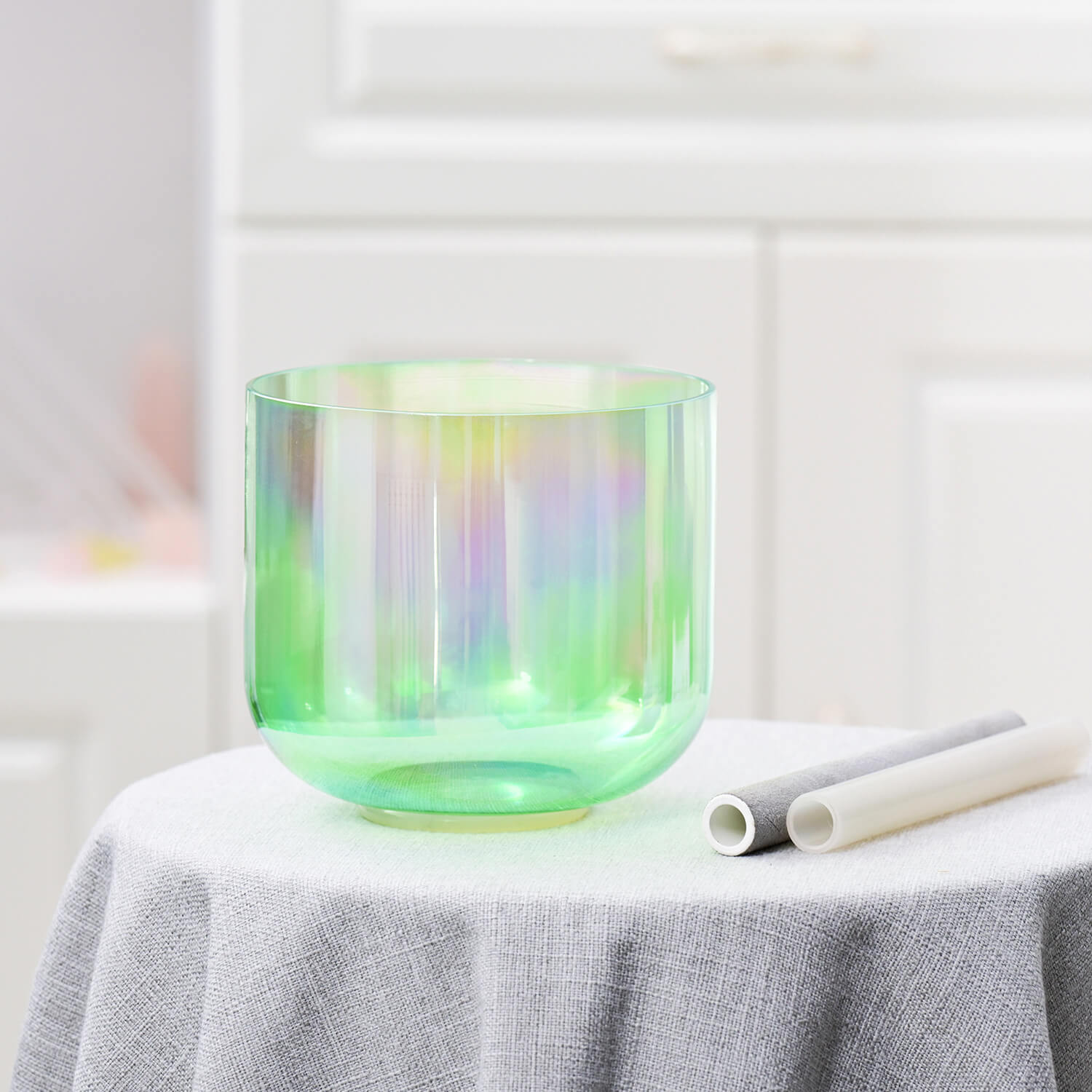 Iridescent green glass bowl with modern geometric shape in Cosmic Light Singing Bowl Set