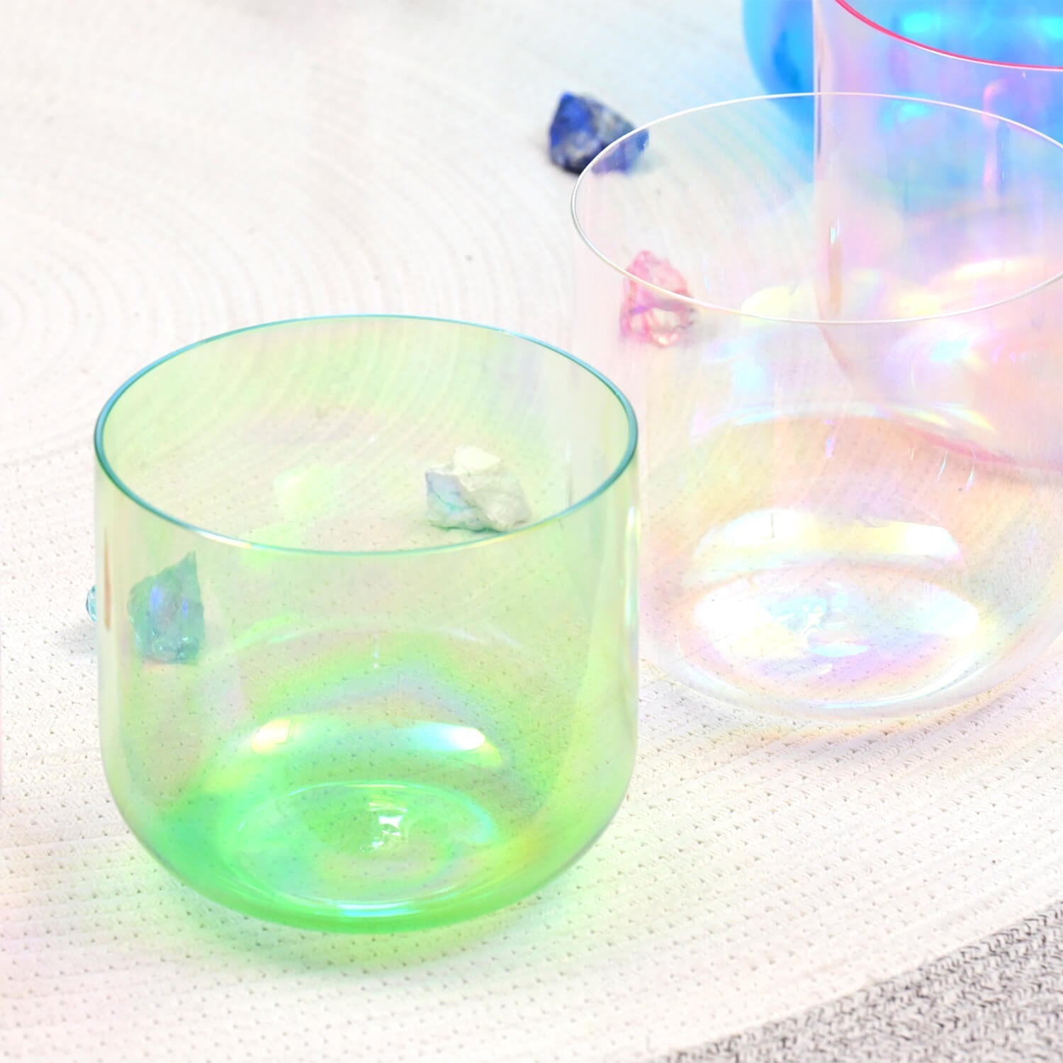 Translucent green glass vessel with iridescent sheen in Cosmic Light Crystal Singing Bowl Set