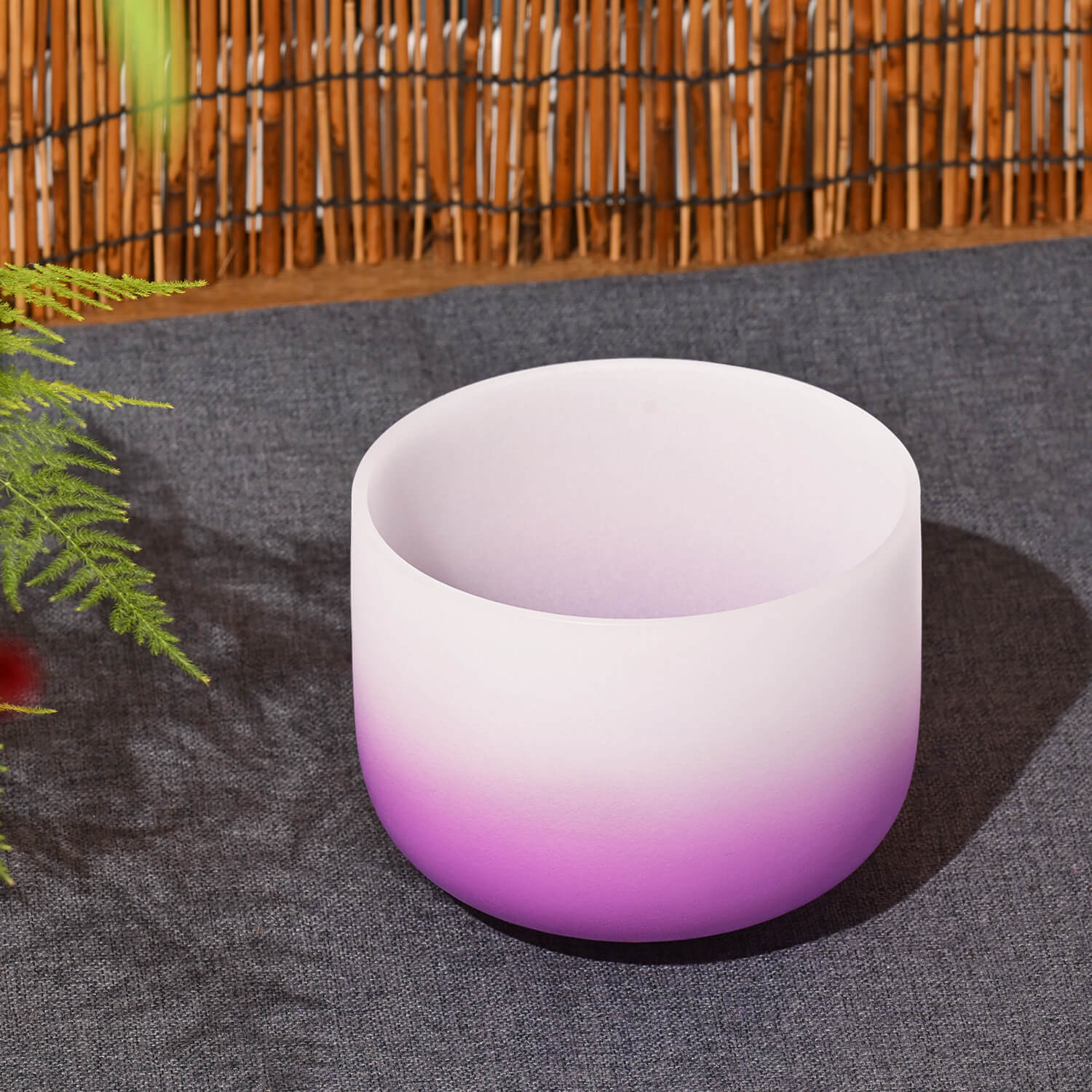 White and purple ombré crystal singing bowl for Crown Chakra sound healing meditation