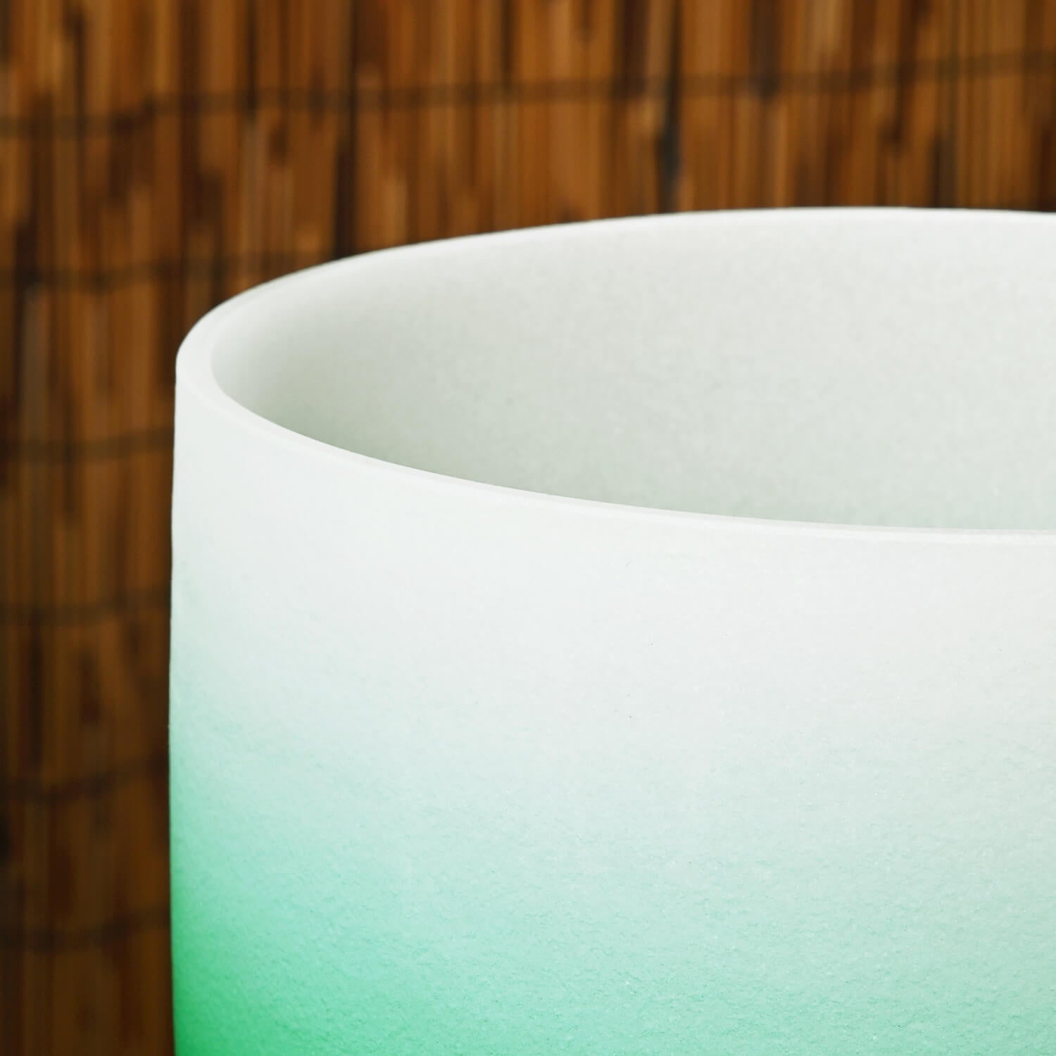 White ceramic cup with mint green fade for Heart Chakra Sound Bowl meditation