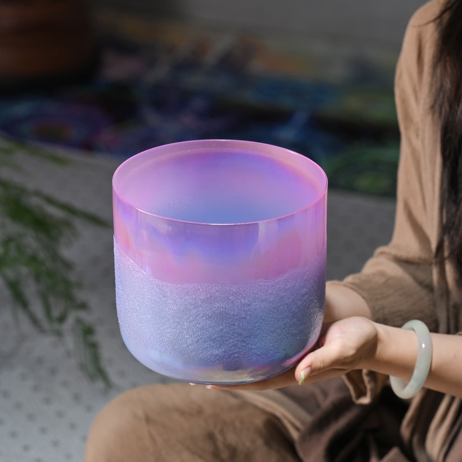 Frosted crystal singing bowl in pink and purple for sound healing