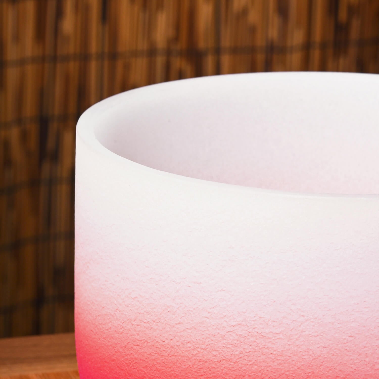 Pink and white gradient frosted glass vessel of Crystal Singing Bowl for Root Chakra healing