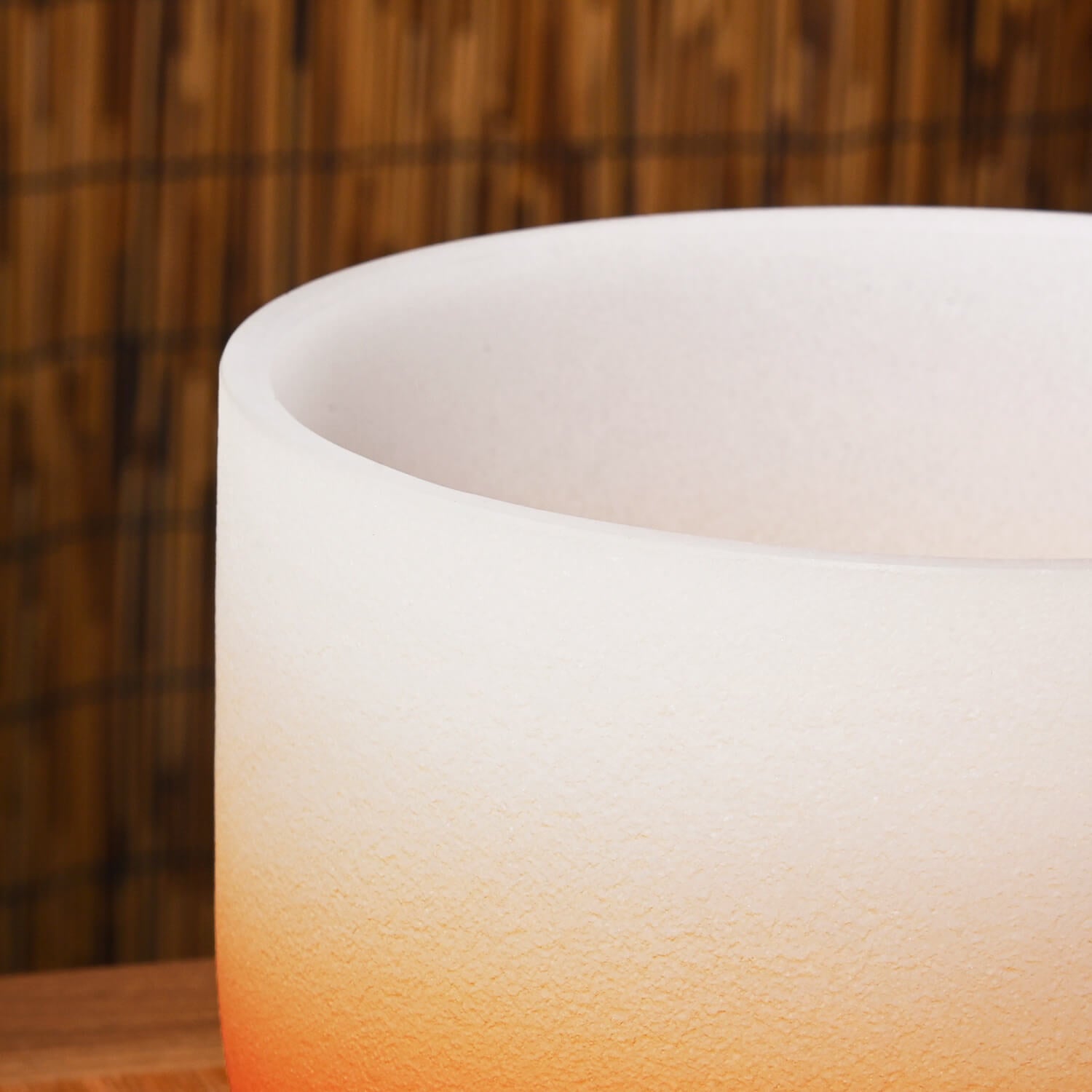 White frosted glass crystal singing bowl with orange gradient for Sacral Chakra healing