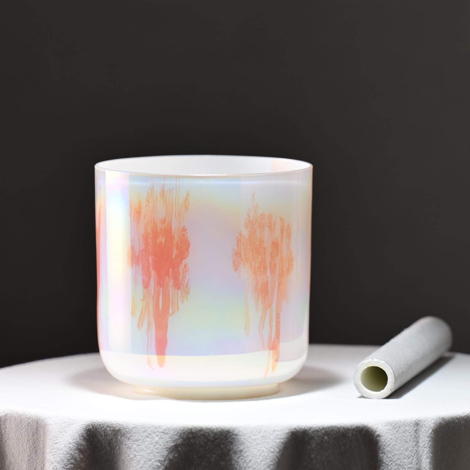 Translucent white cup with coral watercolor streaks for sound healing therapy