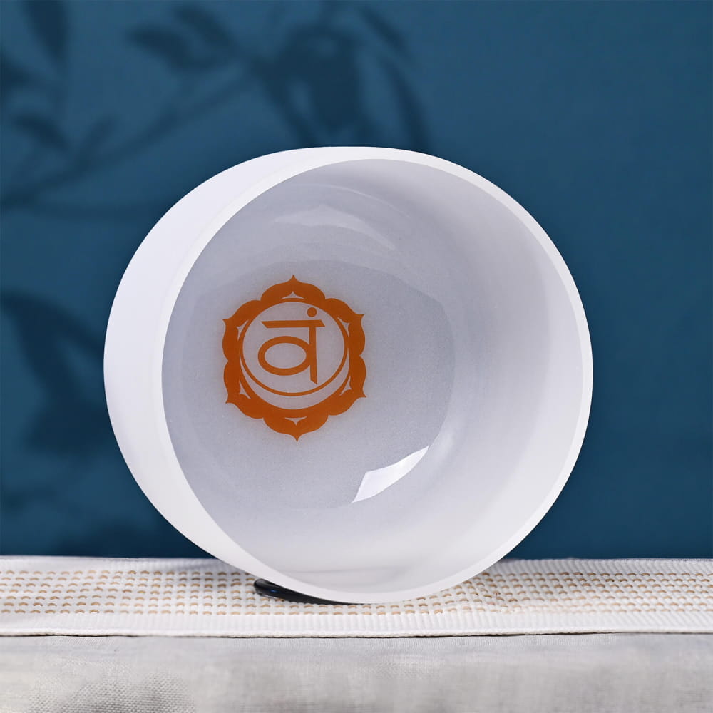 White ceramic bowl featuring an orange chakra symbol for meditation and healing