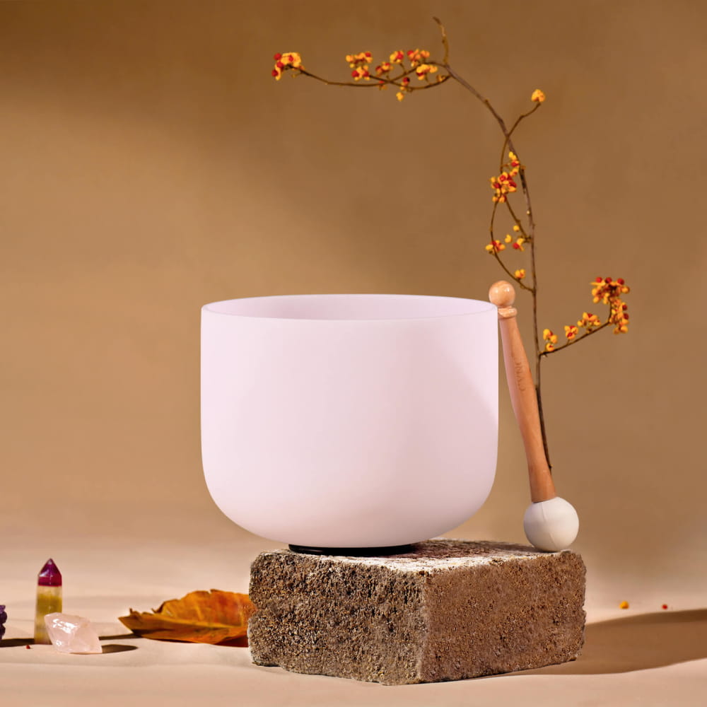 White ceramic bowl on concrete block with D Note Pink Rose Quartz Gemstone Fusion