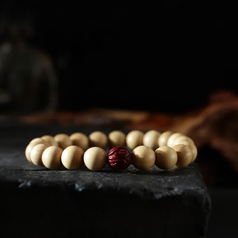 Cinnabar Bracelet with Peach Wood and Lotus Symbols