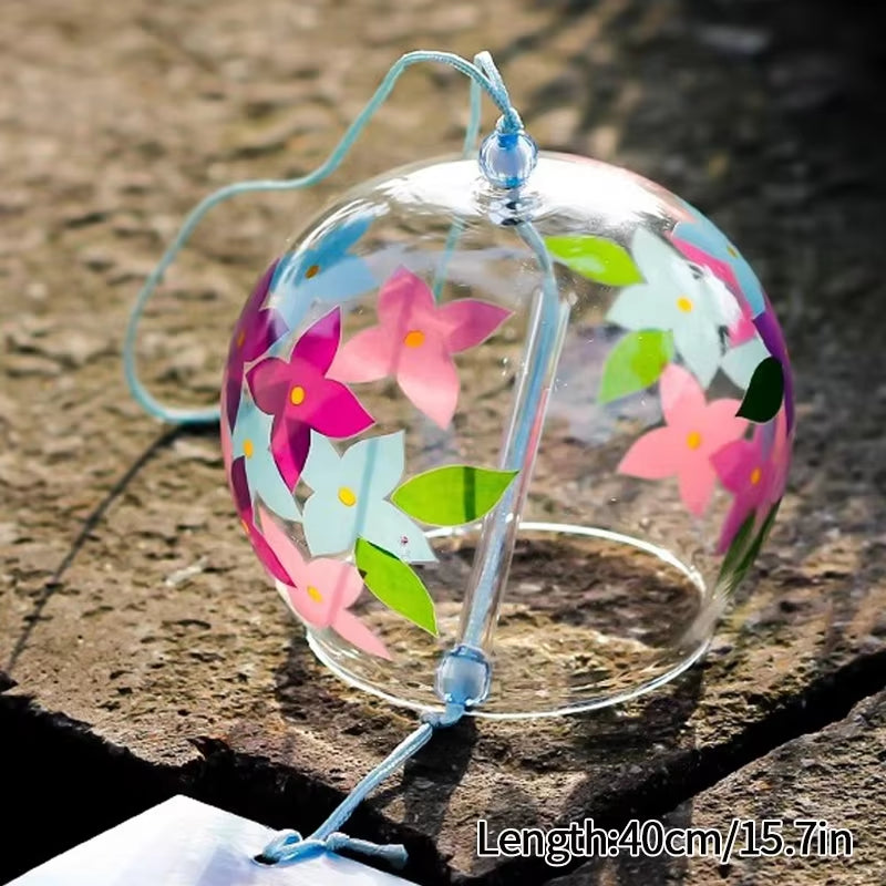 Clear glass wind chime with colorful paper flowers for Japanese outdoor decor