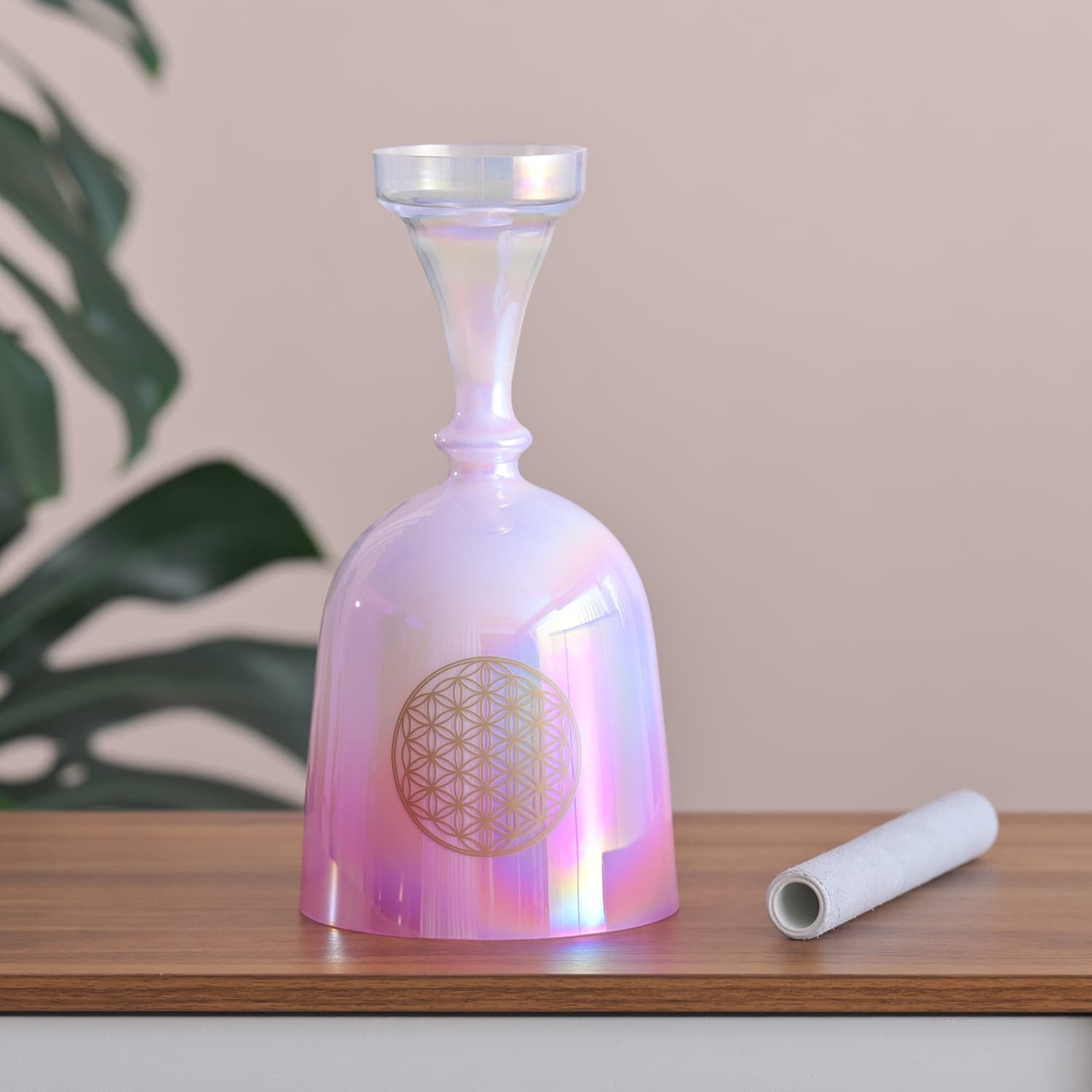 Iridescent pink glass bottle with geometric flower-of-life design for sound healing