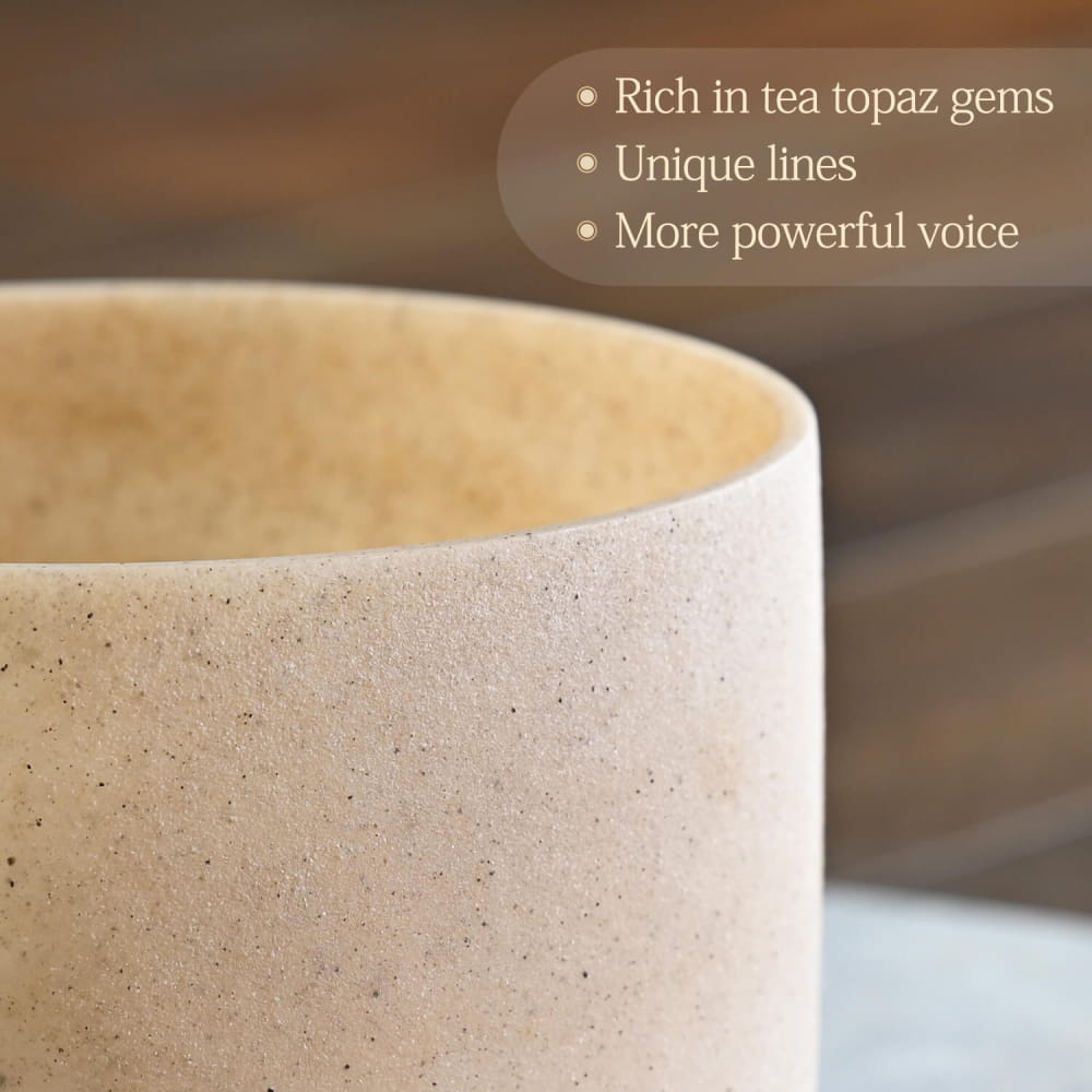 Textured beige ceramic cup with speckled surface for E Note Tea Topaz Gemstone Fusion