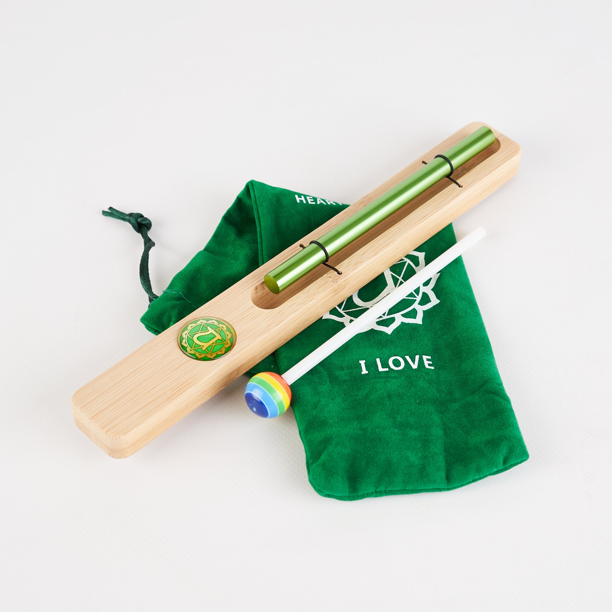 Green metallic tin whistle with wooden fipple block in Energy Bar Chimes for Chakra Meditation