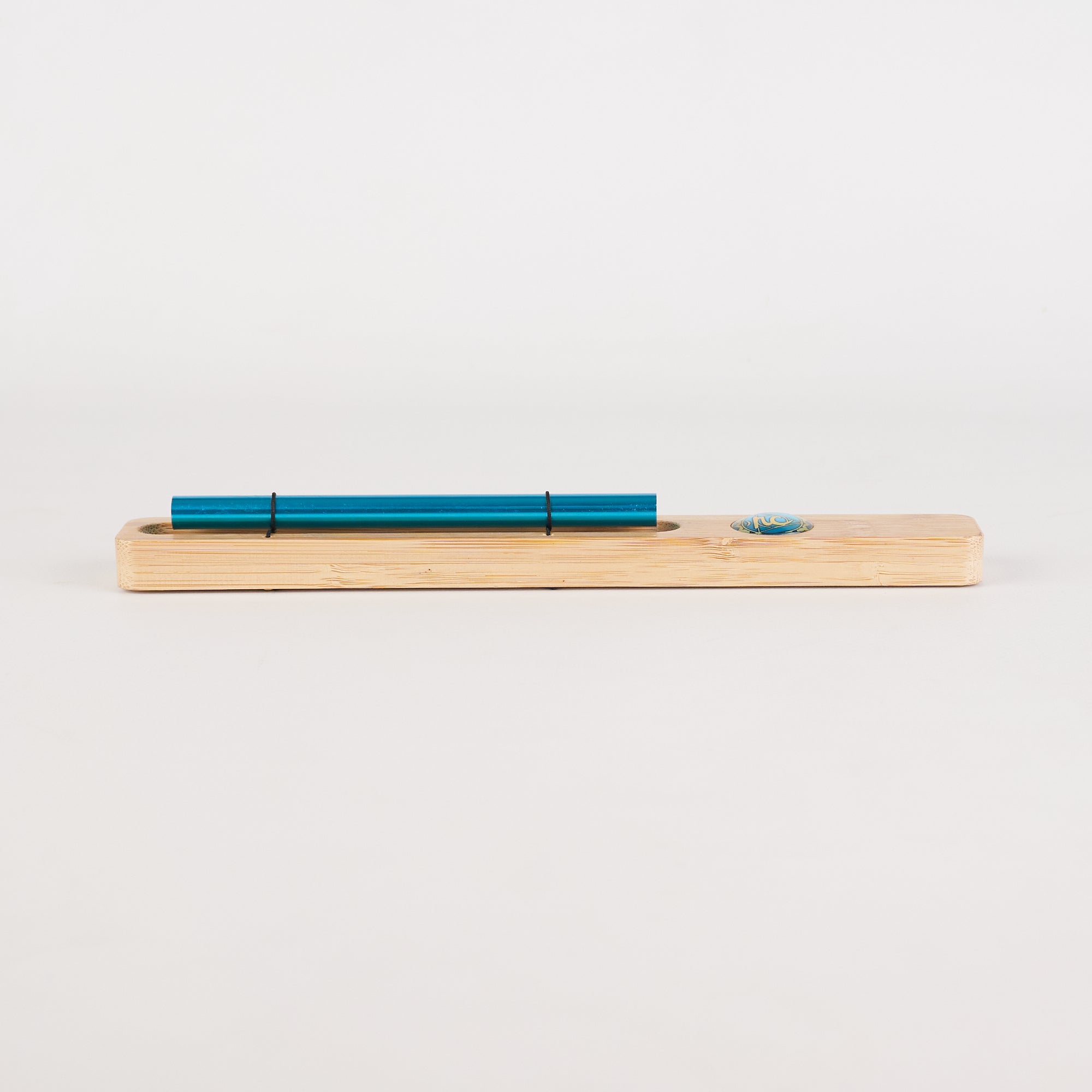 Metallic teal pen on wooden holder for Energy Bar Chimes Chakra Meditation