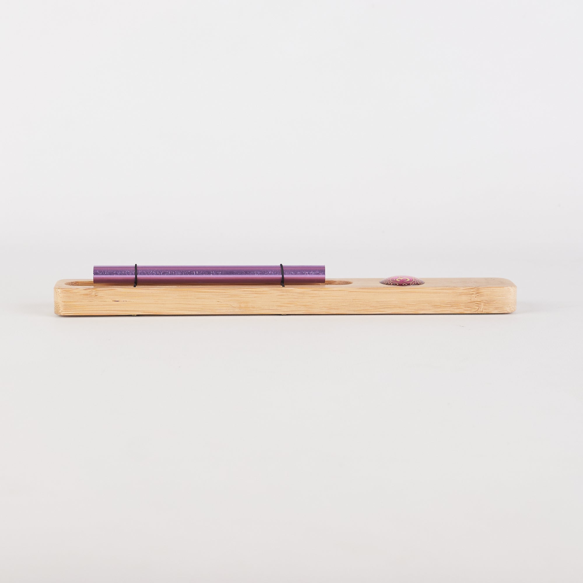 Purple pen on wooden holder for Energy Bar Chimes in Chakra Meditation