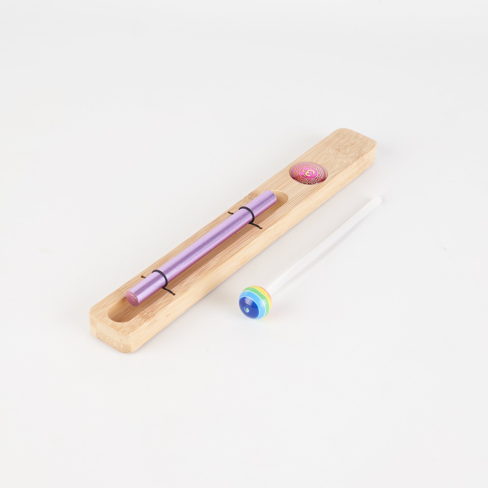 Purple pen in a wooden holder for Energy Bar Chimes and Chakra Meditation