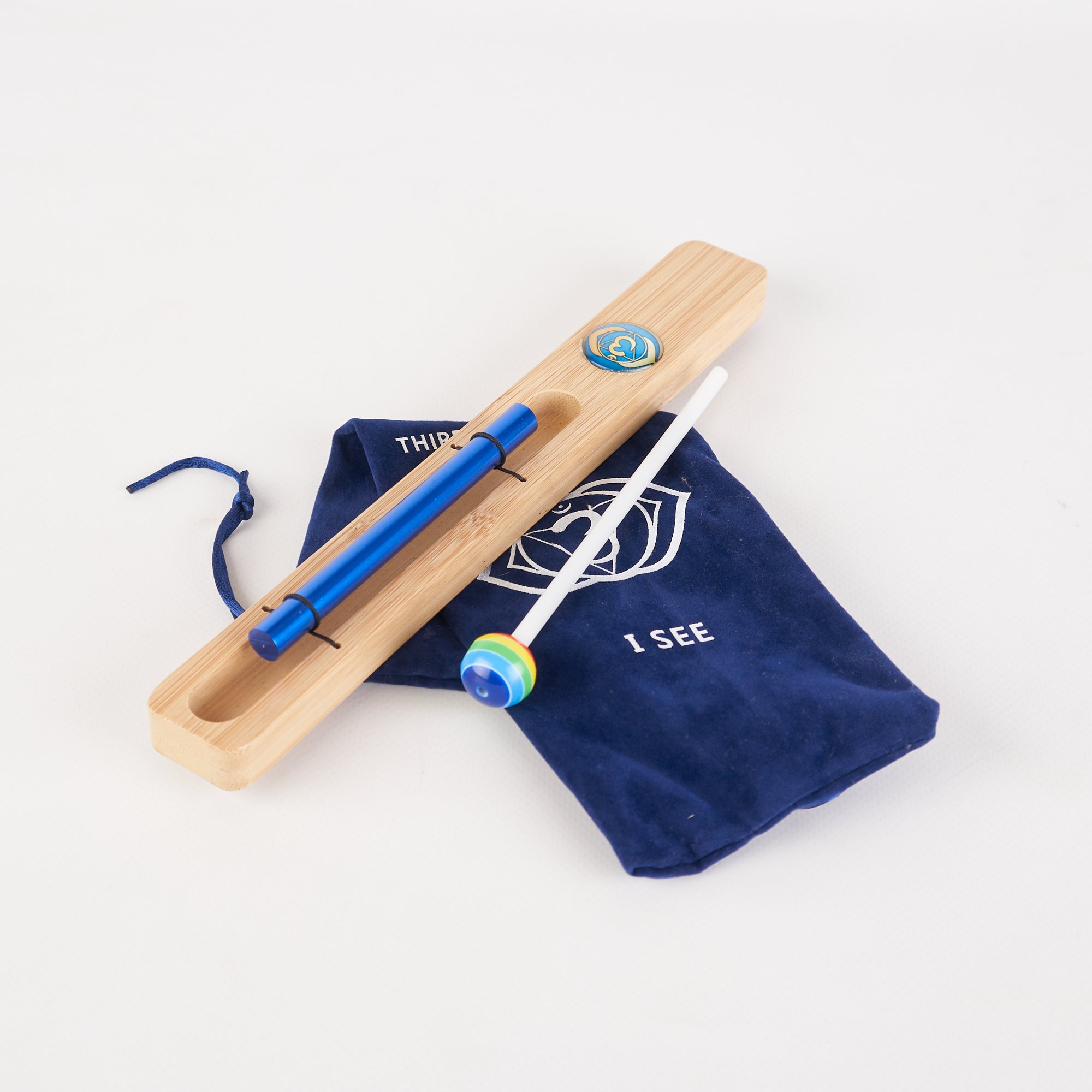 Wooden Kendama toy with blue accents and matching drawstring bag for Energy Bar Chimes