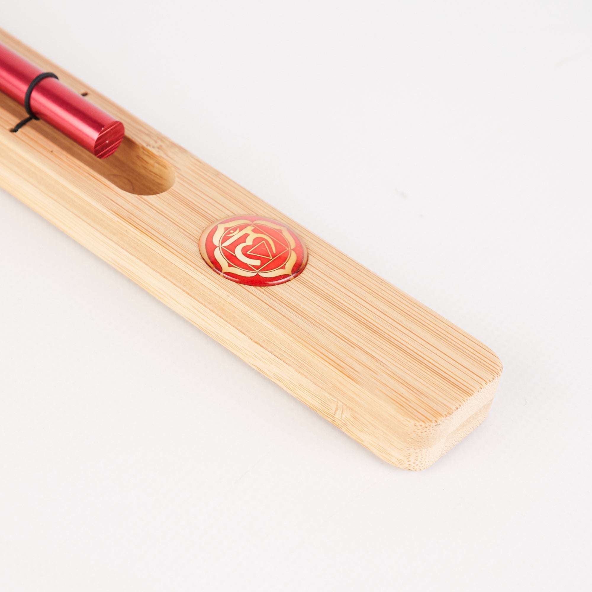 Wooden chopstick rest with red circular design for Chakra Meditation Energy Bar Chimes