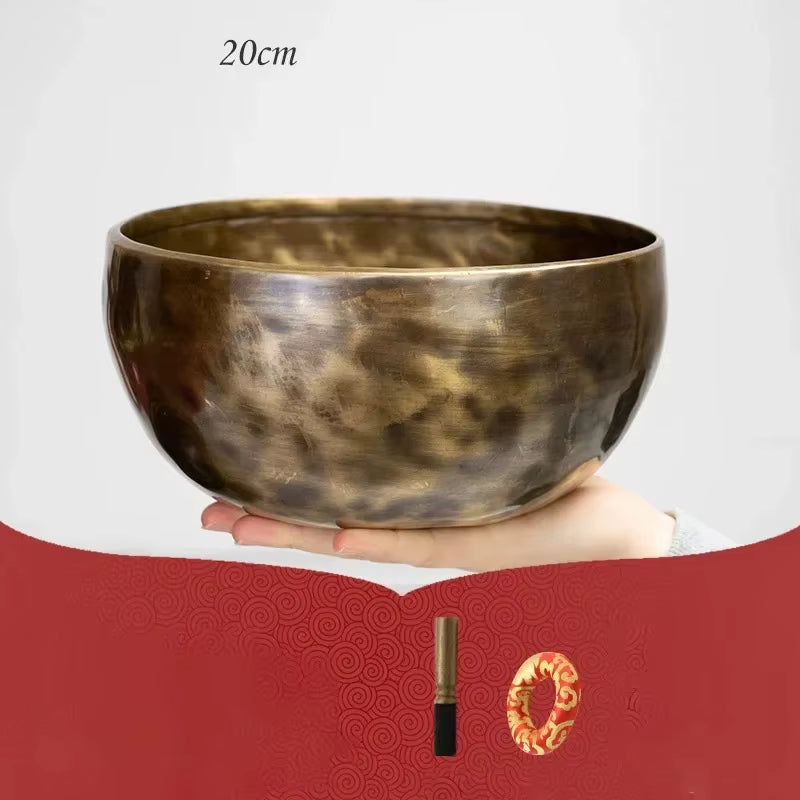 Hand-hammered Tibetan singing bowl with dark metallic finish for meditation use